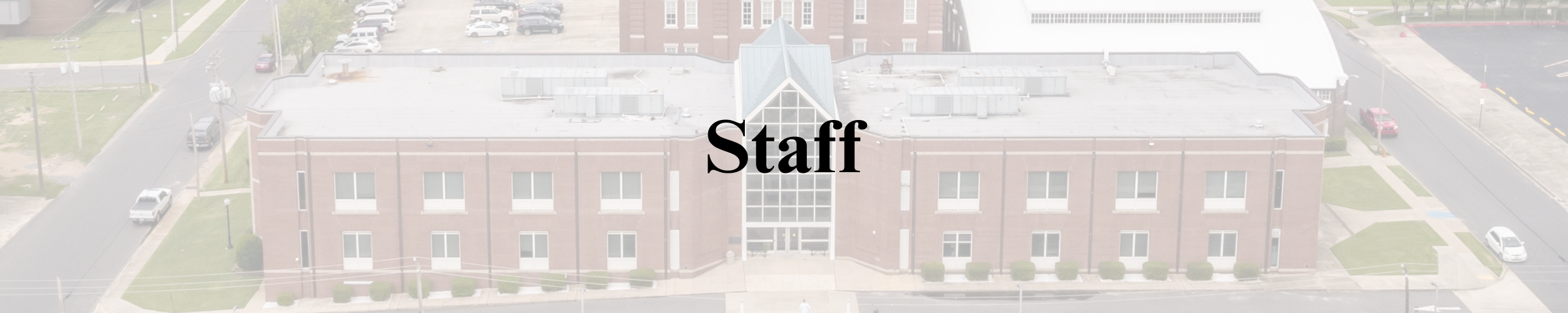 Staff text banner with SouthArk Whitfield building in the background