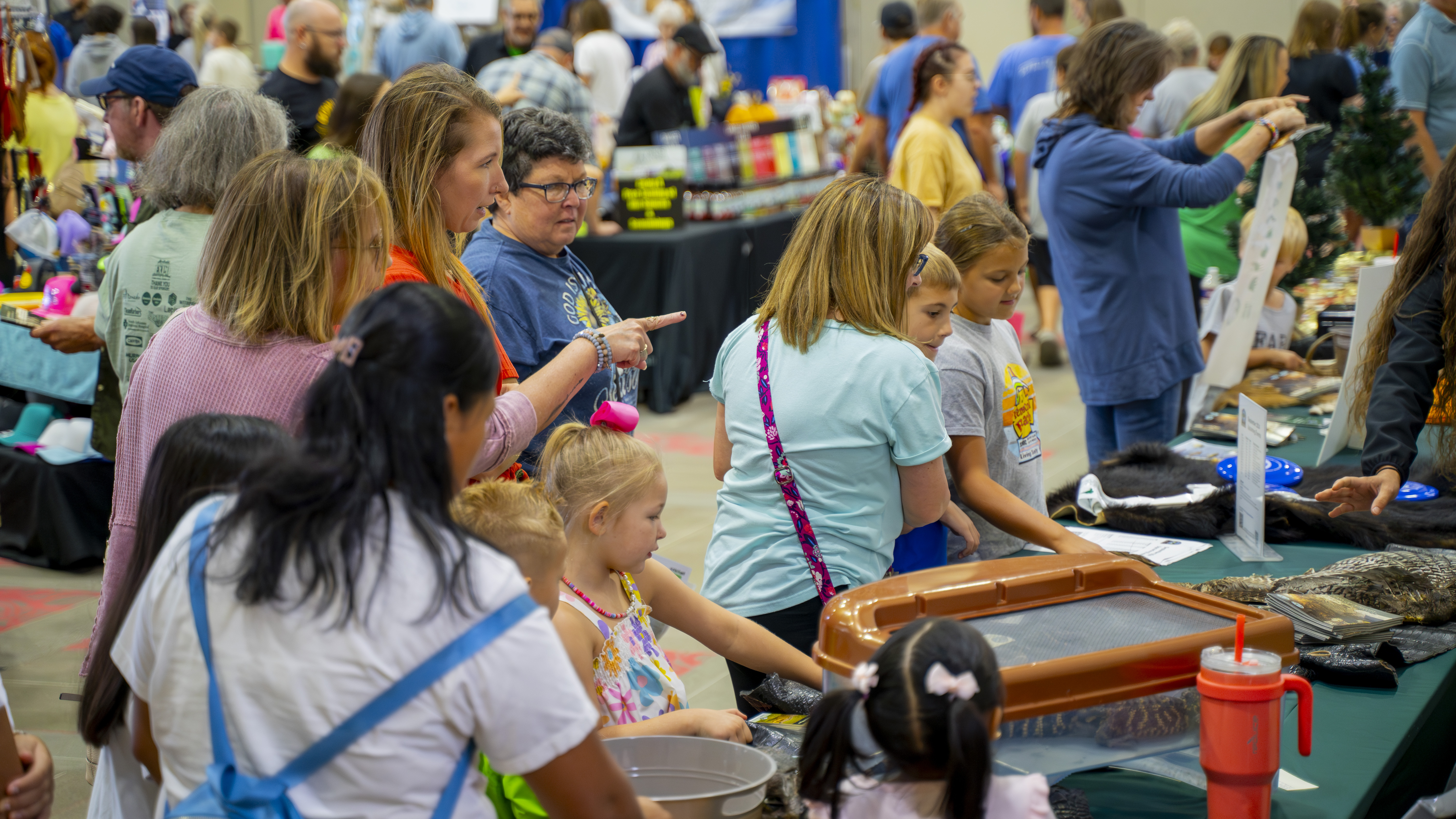 Picture of patrons interacting with vendor booths