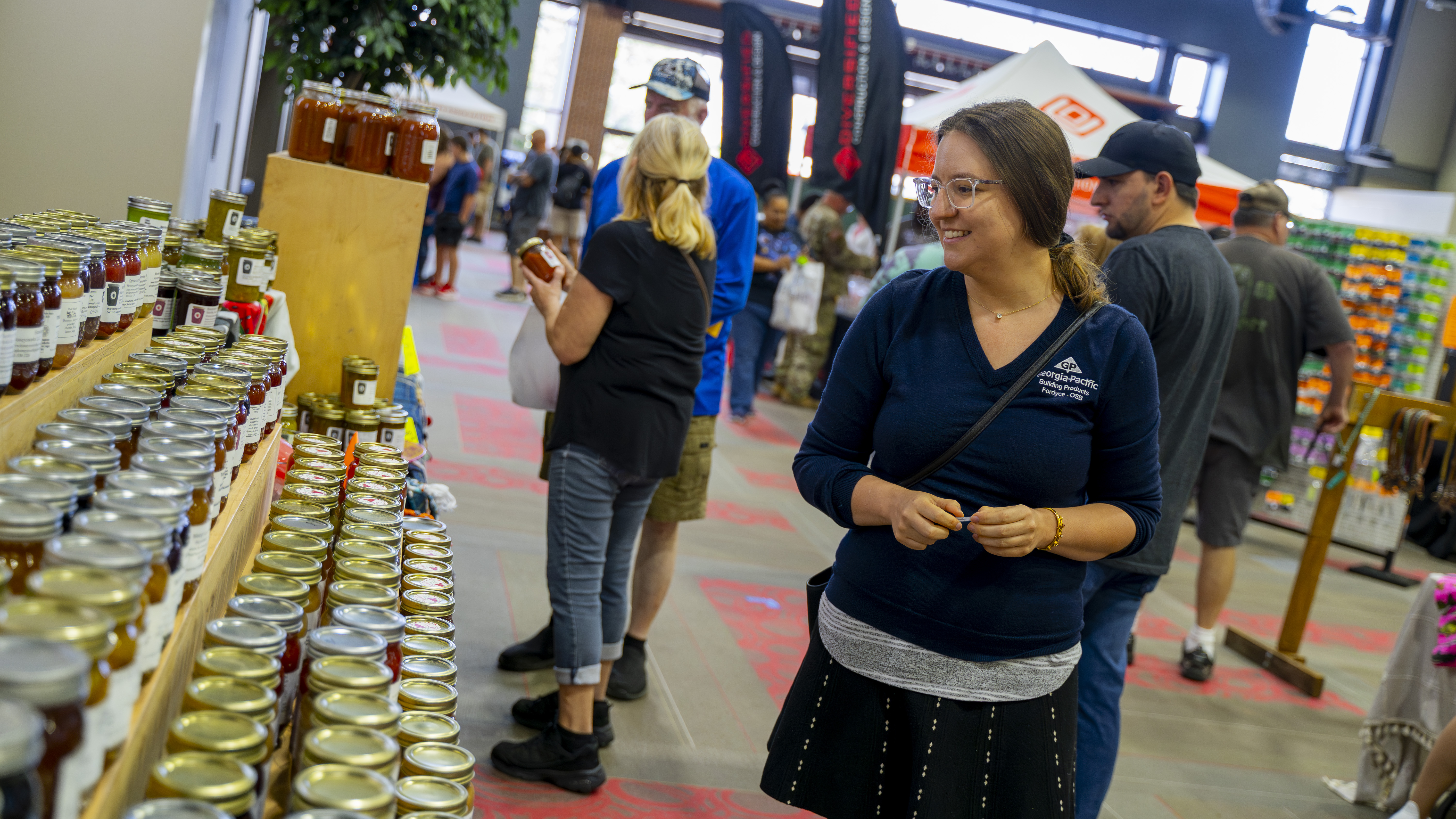 Picture of women looking at various jarred goods