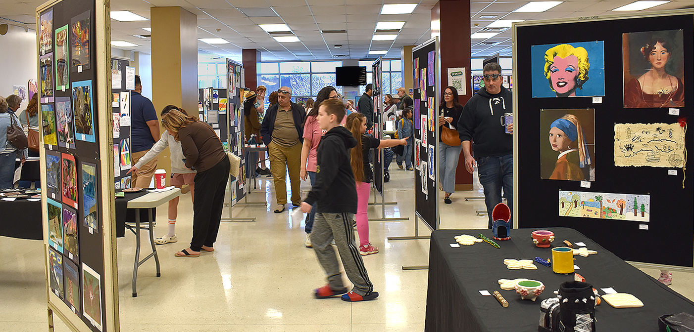 image of many people looking at exhibits at the District Arts Fair