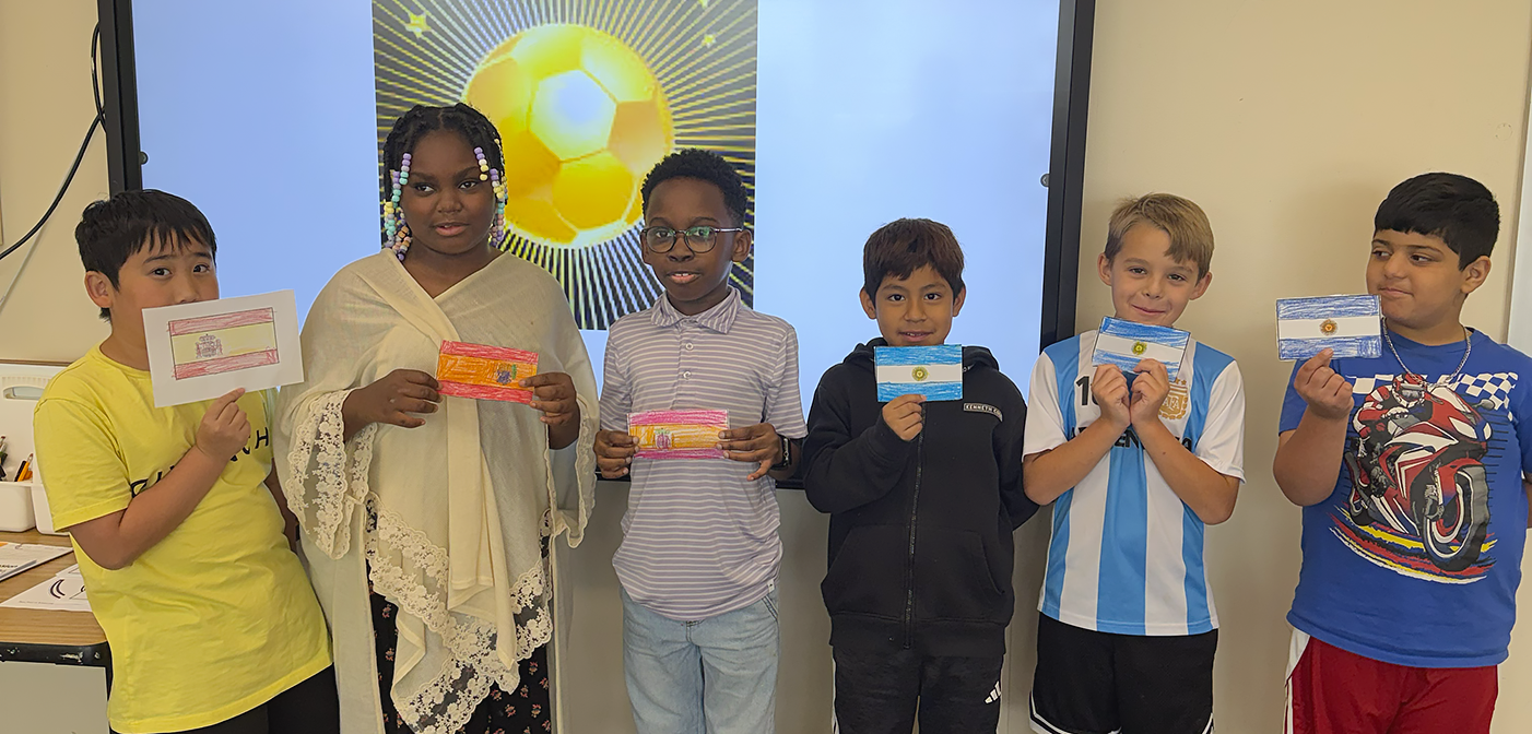Six TIS Summer learning academy students holding up a country flag of the team they're rooting for in the World Cup Final.