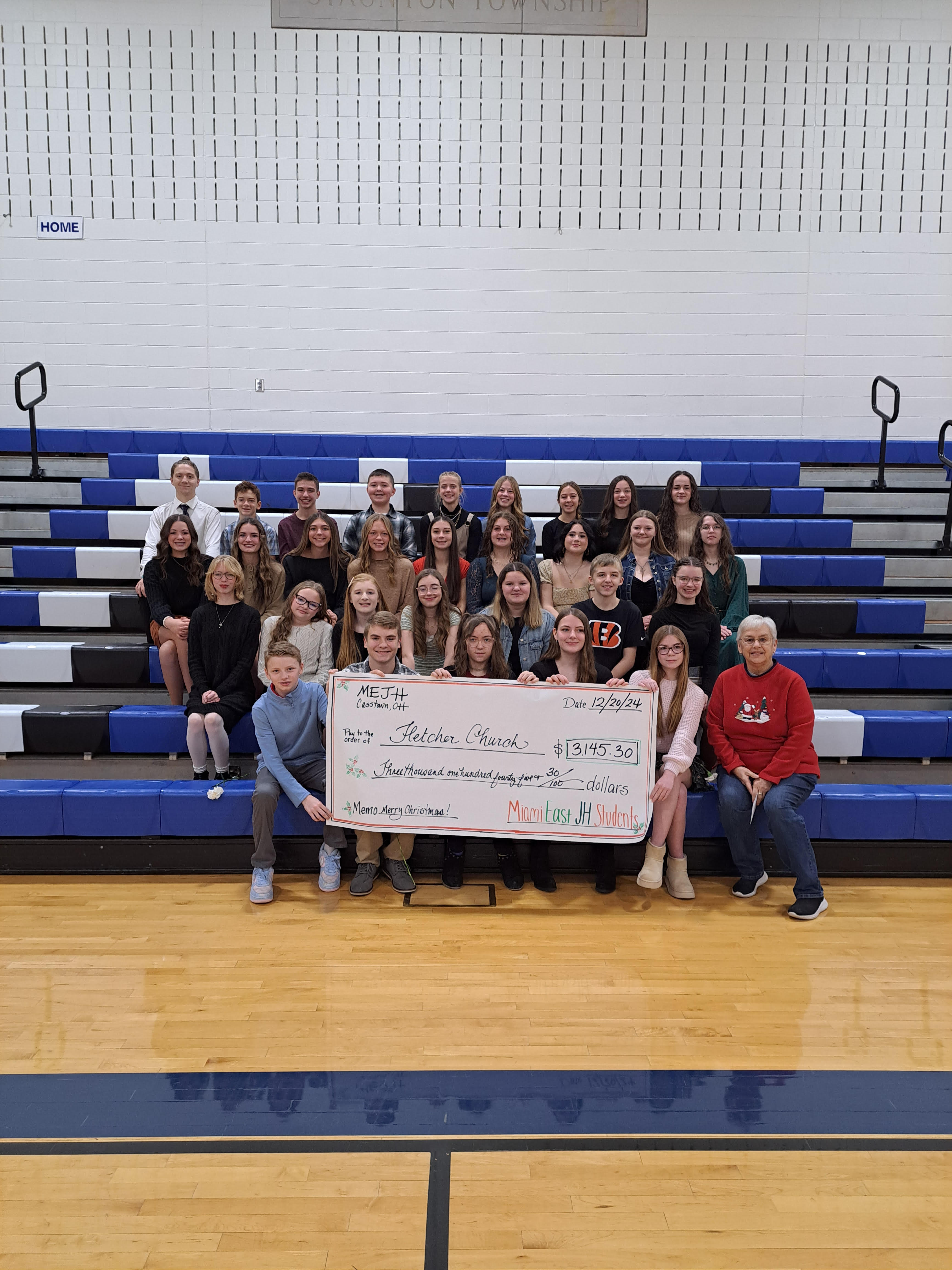 JH Students awarding a check to Fletcher Food Pantry