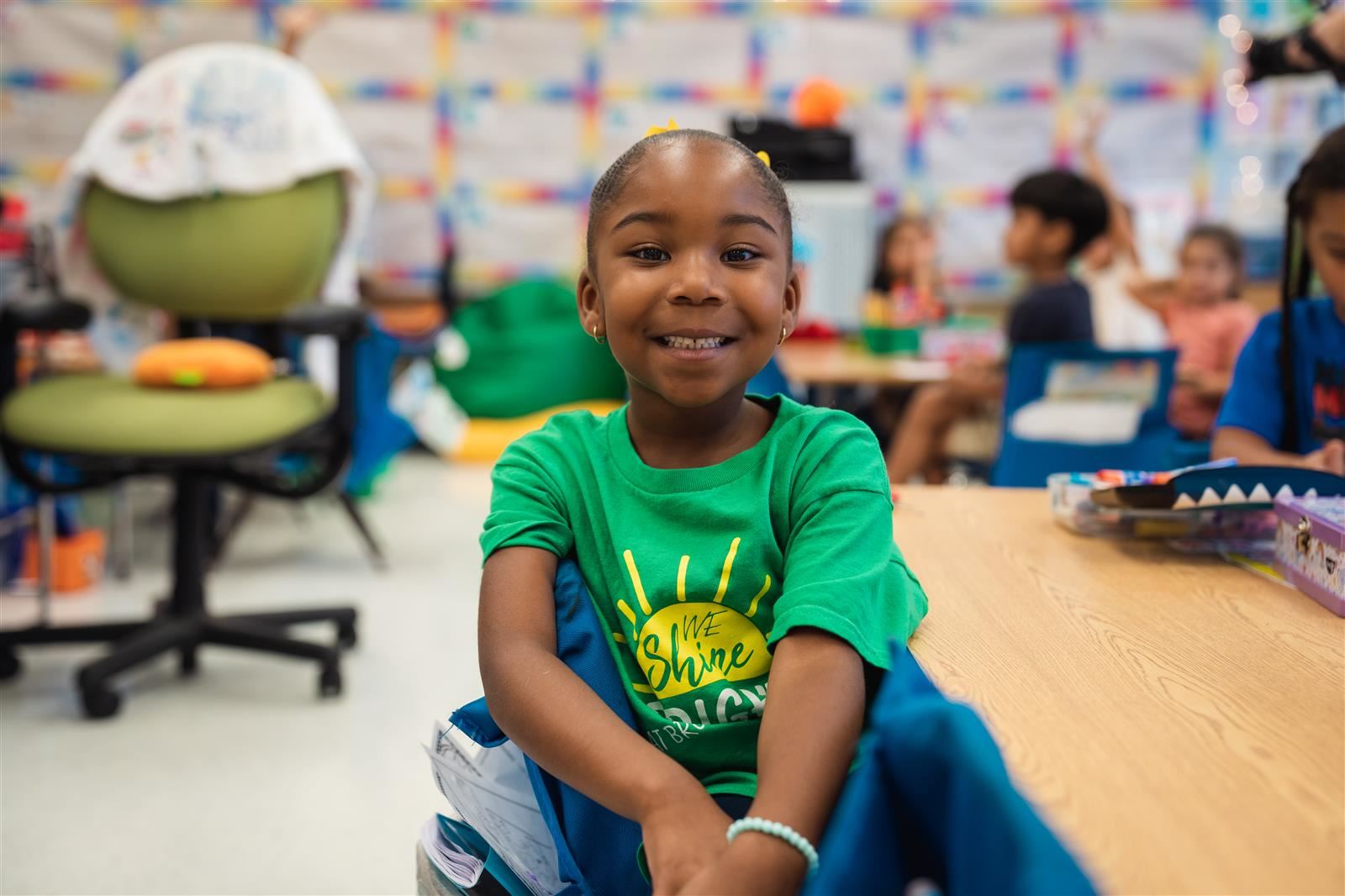 Kindergarten student smiling at the camera