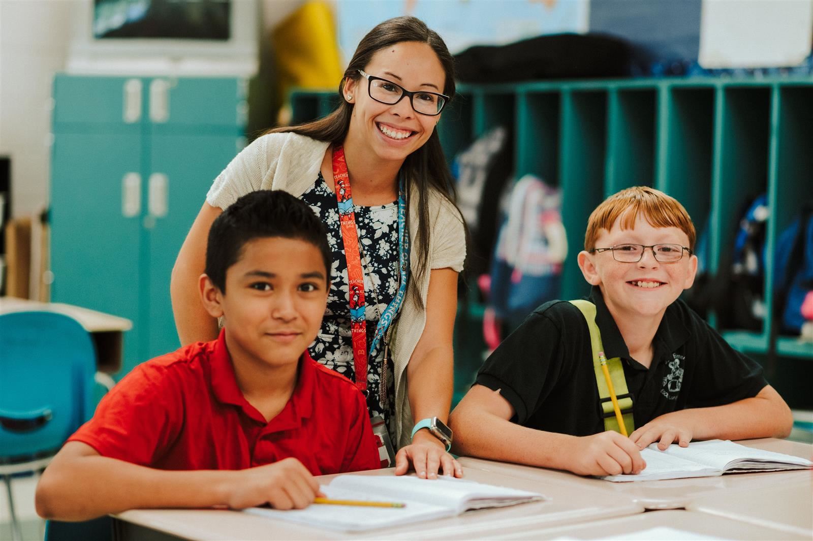 Students and teacher smiling