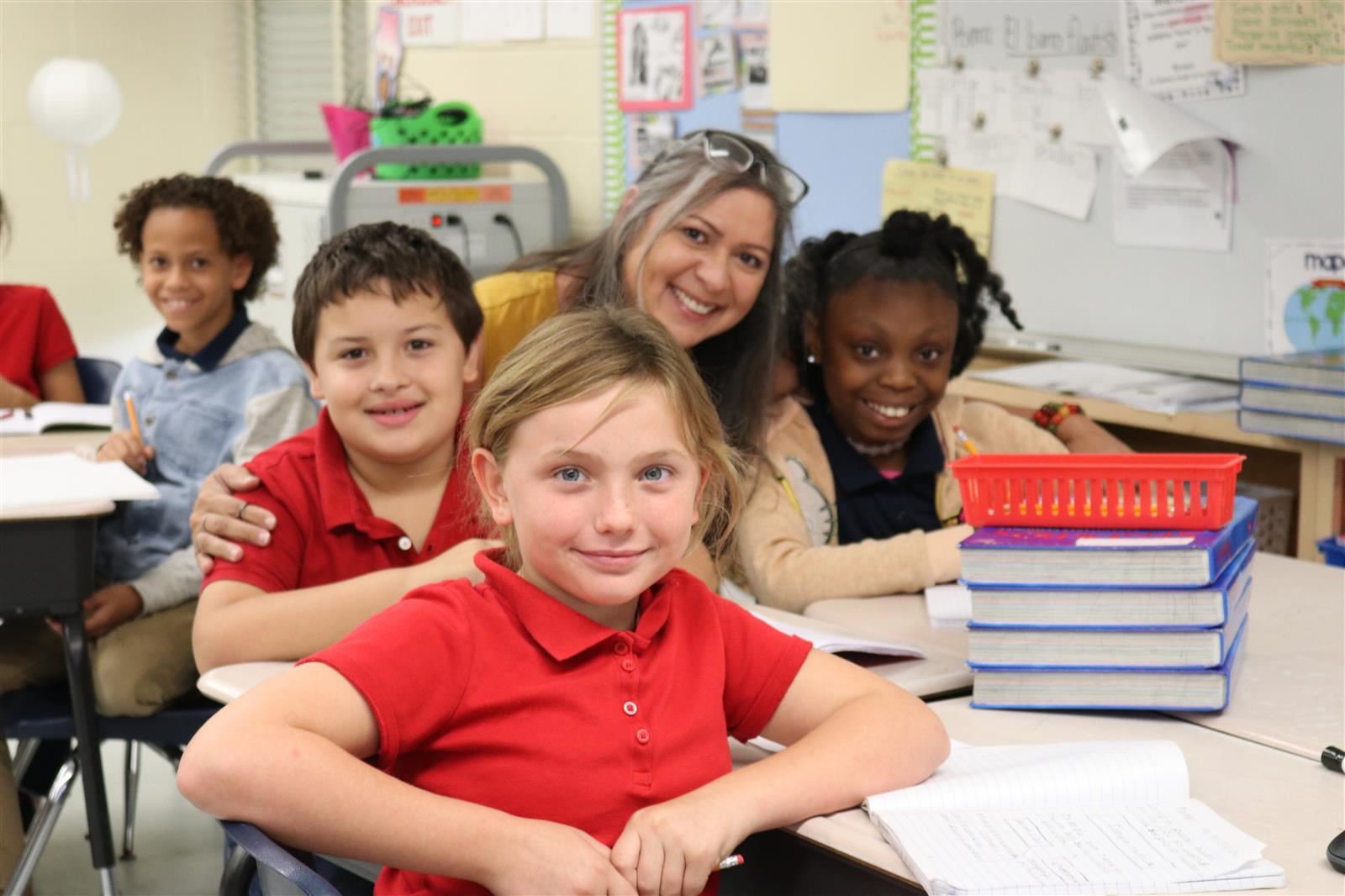 Teacher and students smiling