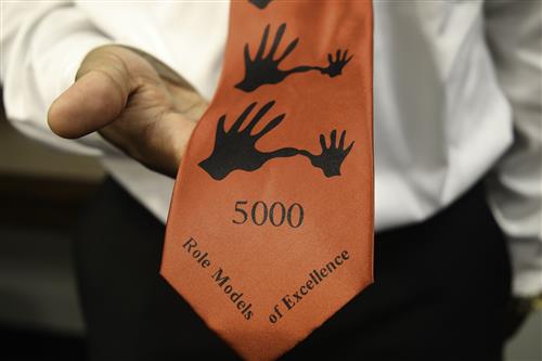 Photo of 5000 Role Models member showing his tie