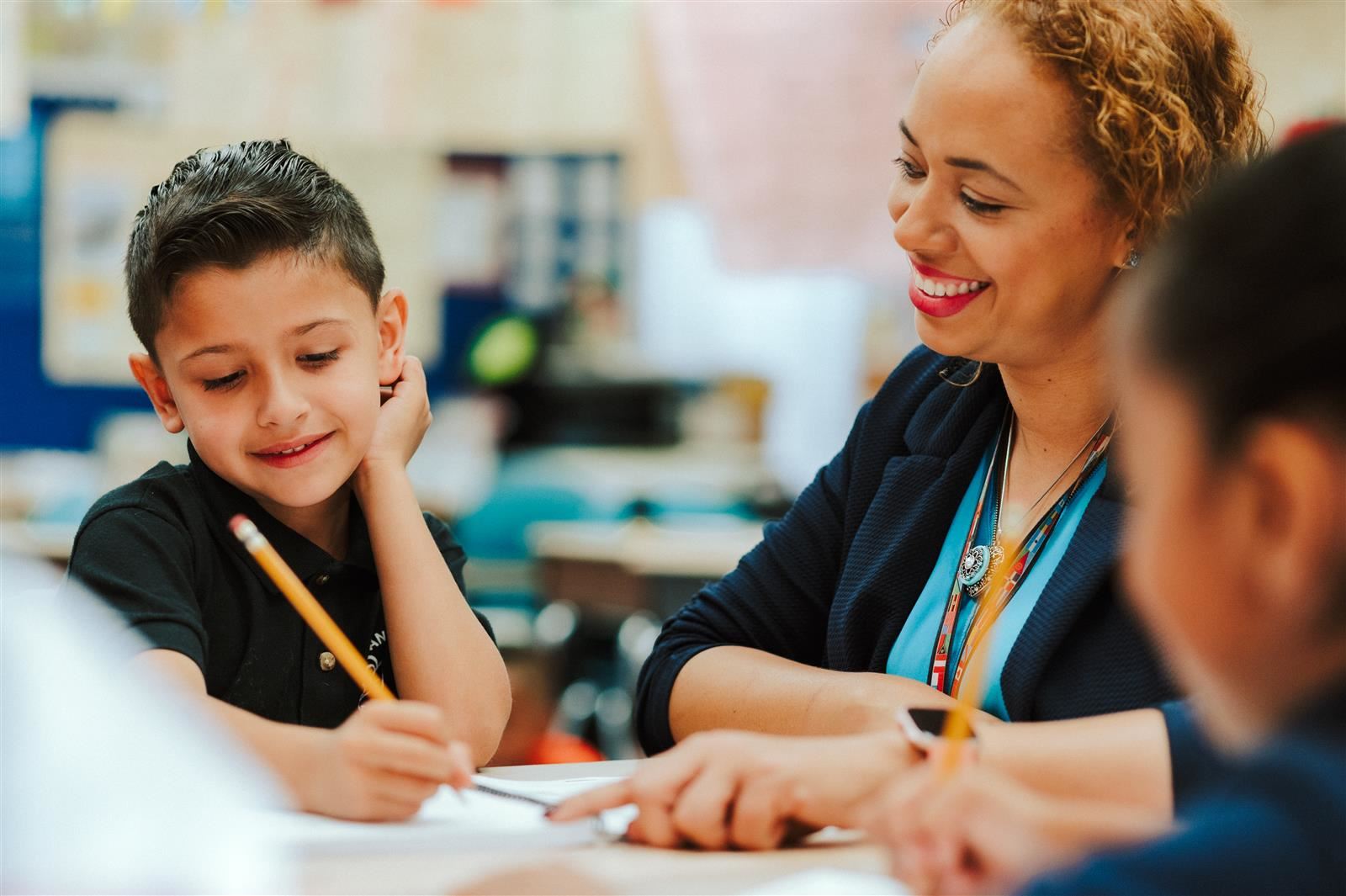 Teacher and student writing