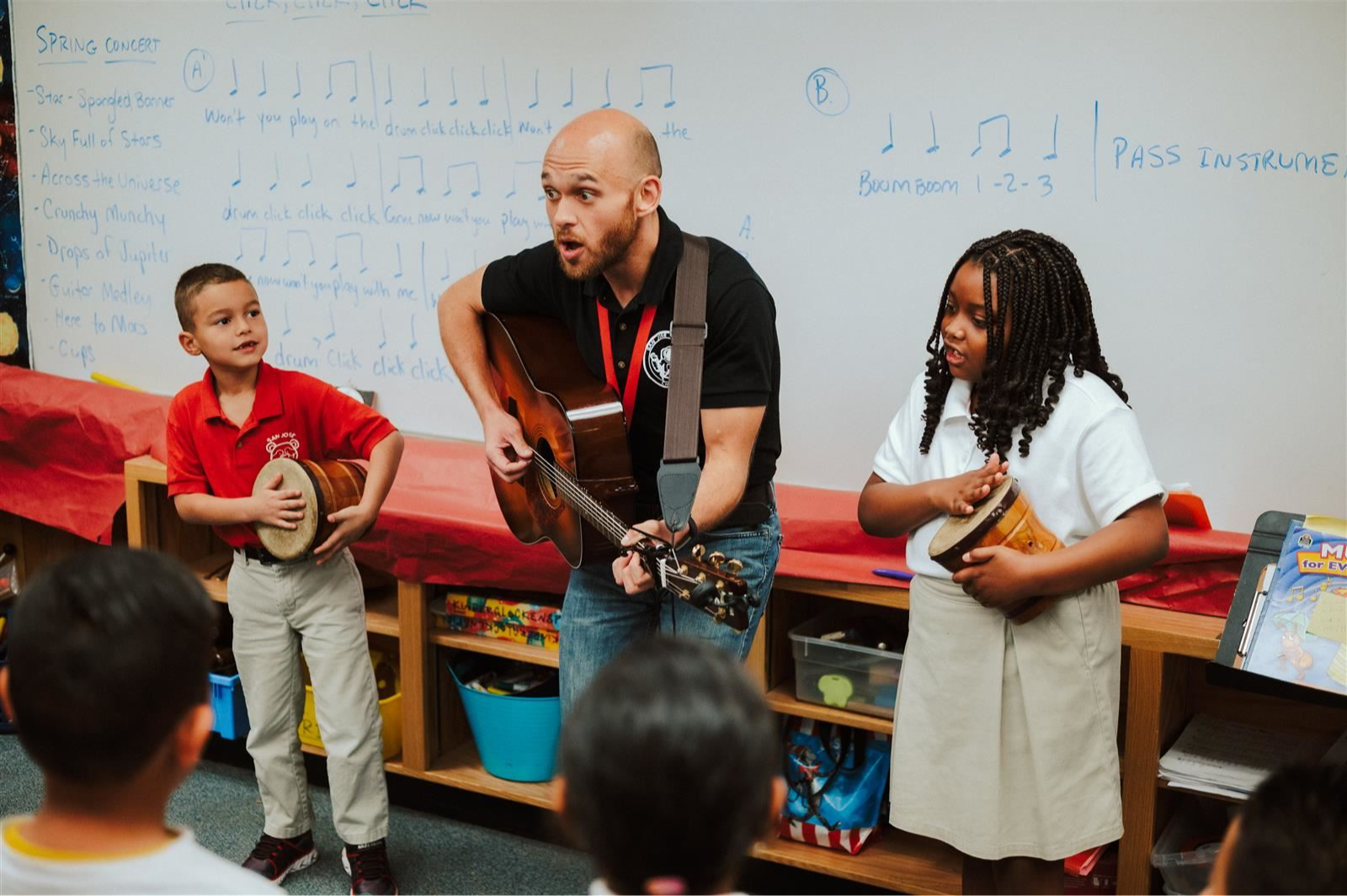 Students and teacher in music class