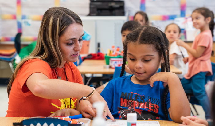 Teacher helping a student