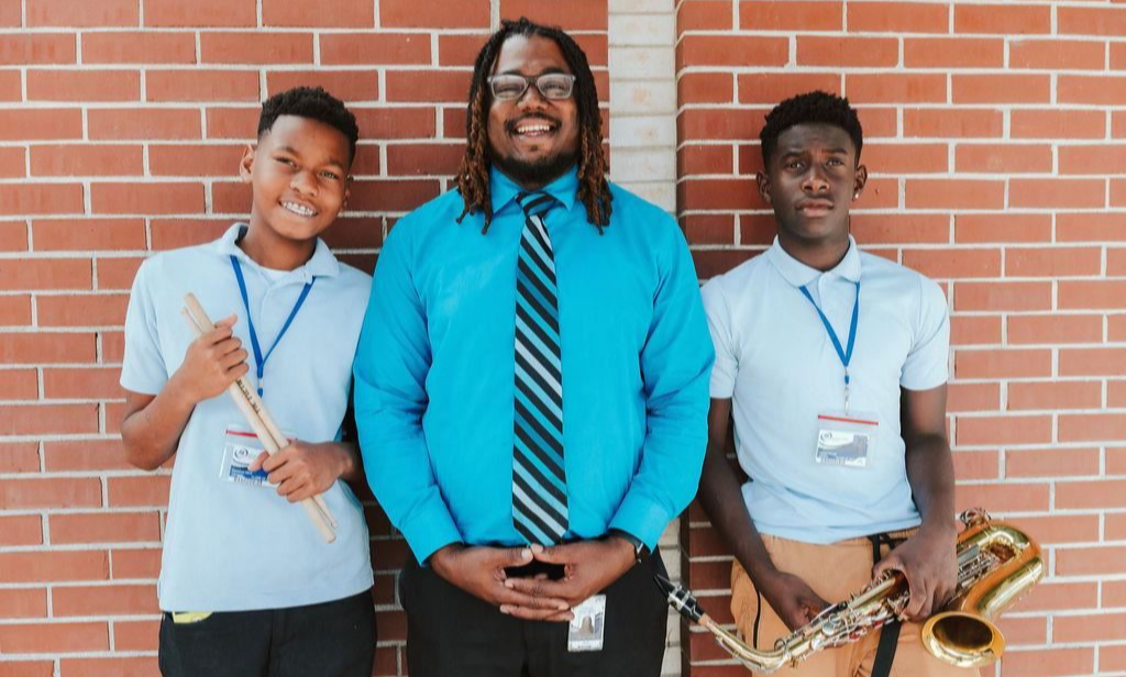 Students and teacher smiling