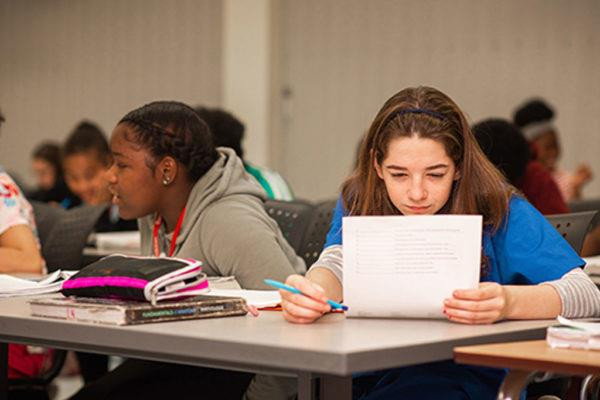 Two students doing classwork