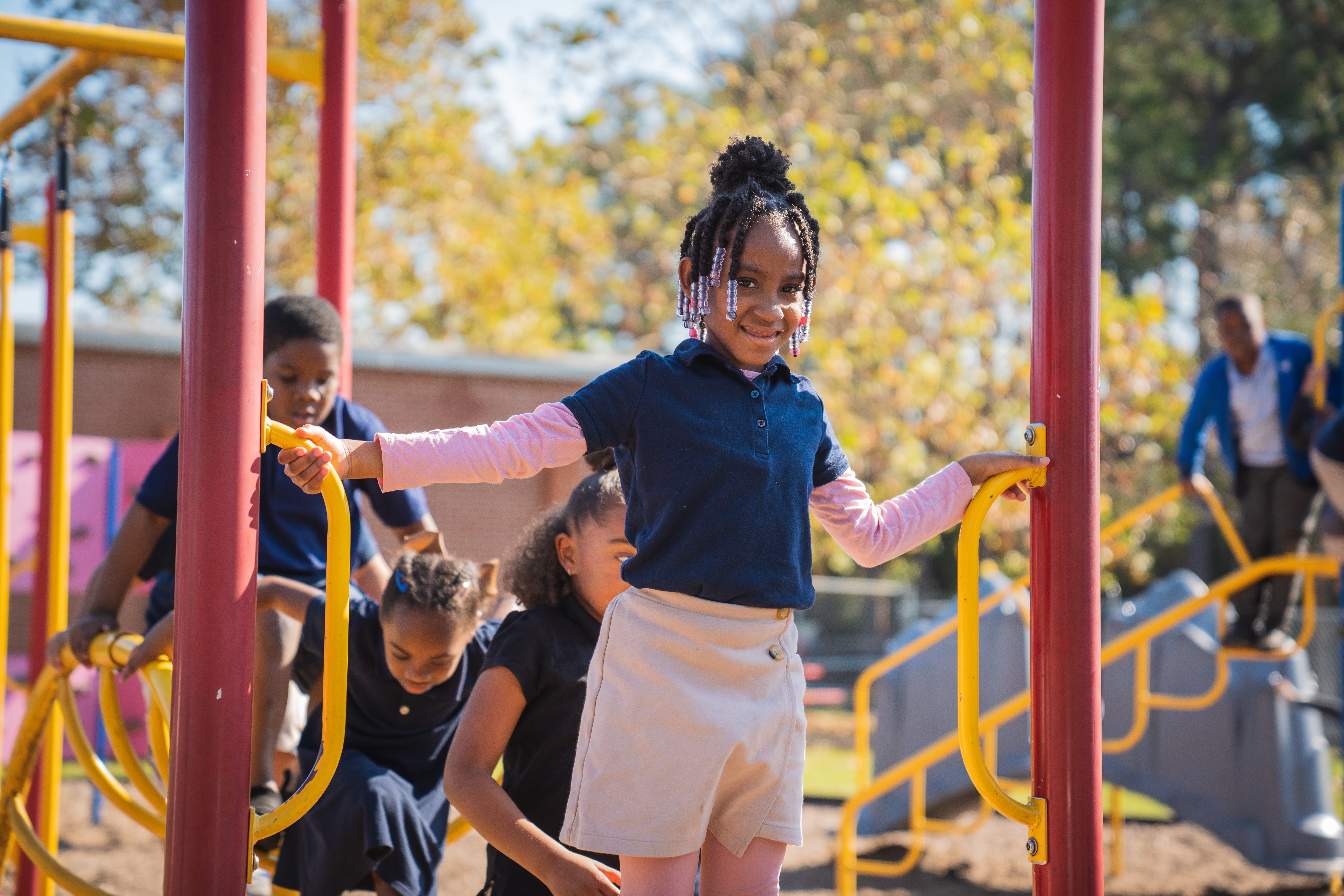 Duval County Public Schools Elementary school student plays on playground equipment 