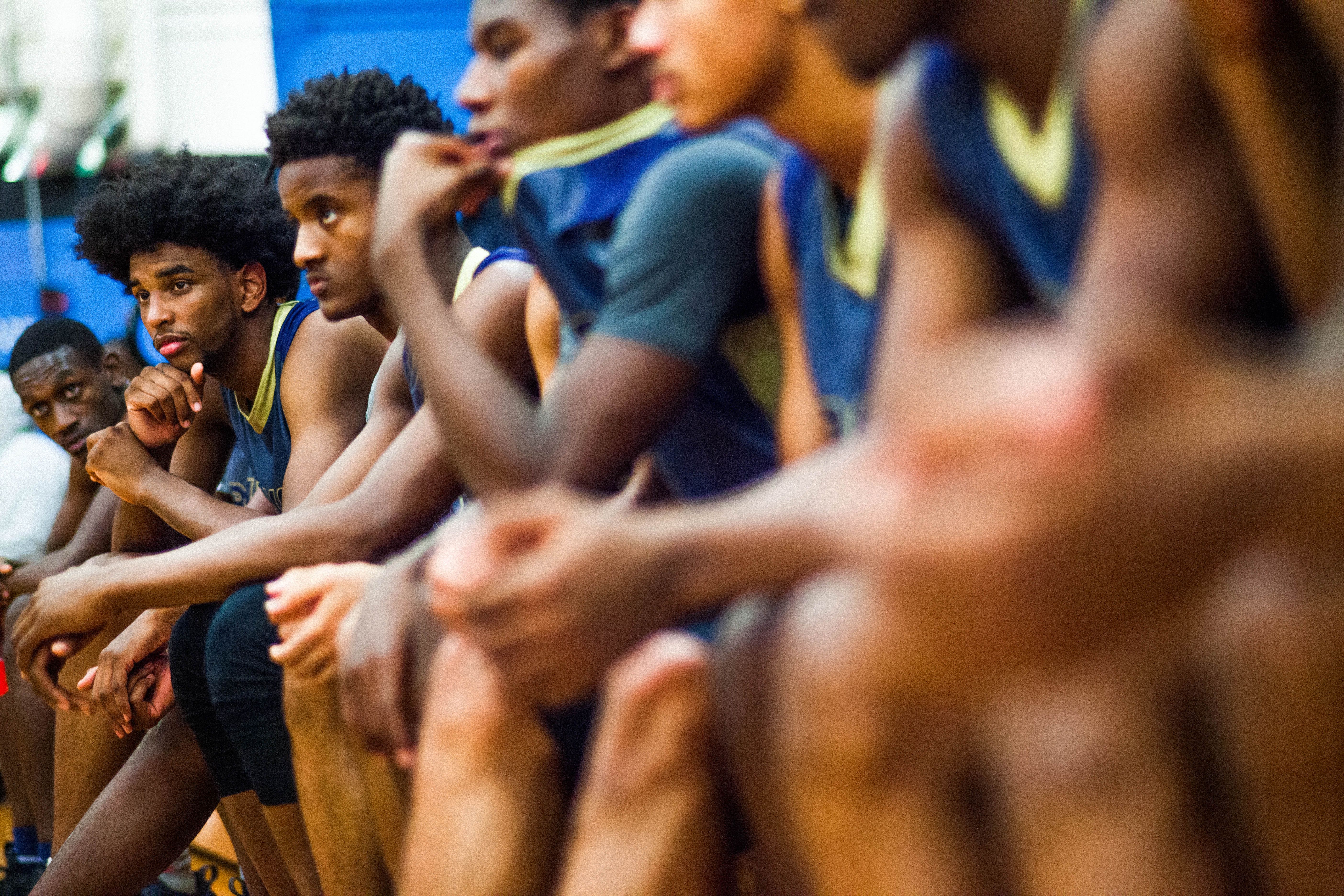 Duval County Public Schools basketball players on bench