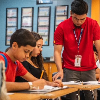 Teacher and students in class together. 