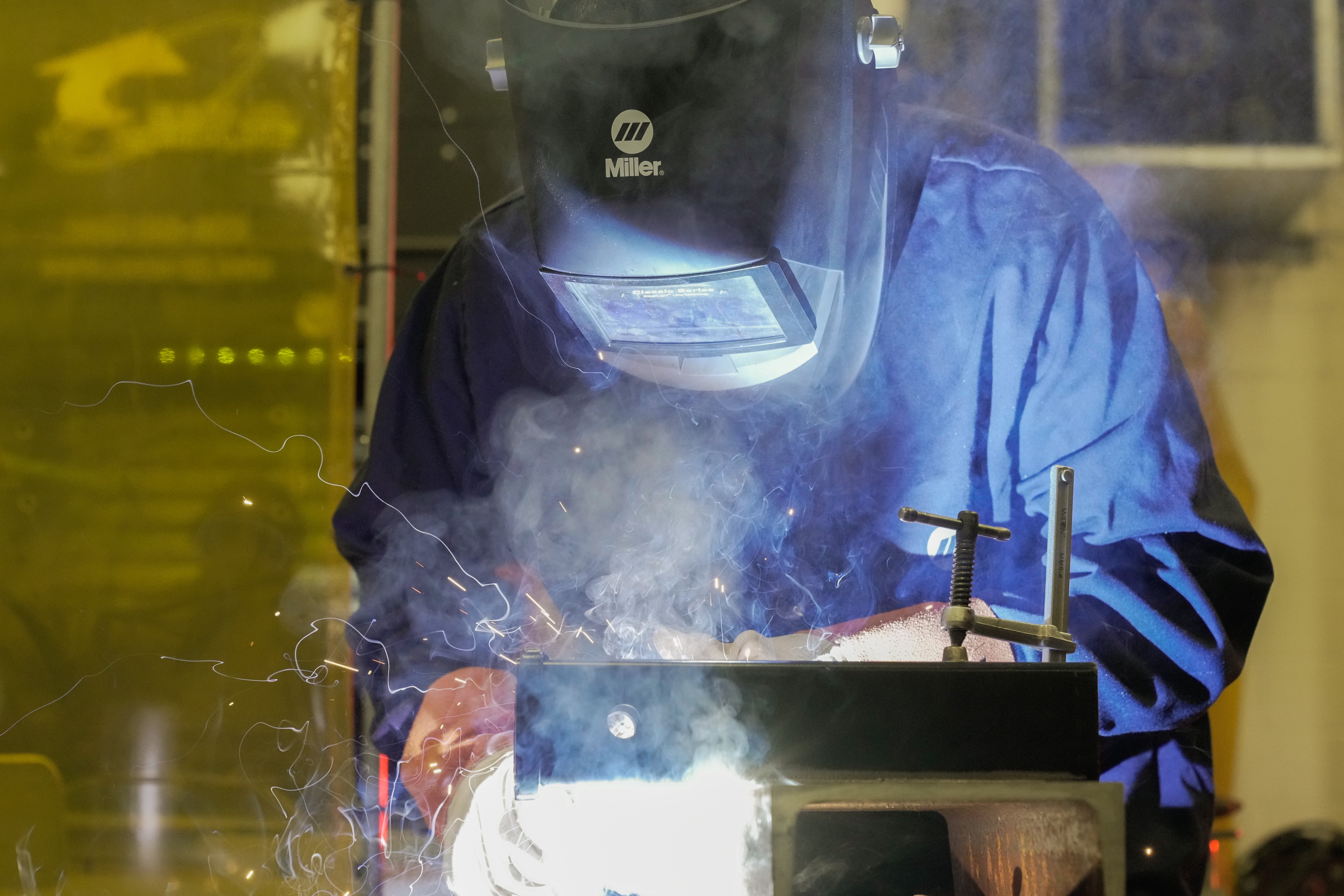 Duval County Public high schools student welding and wearing mask