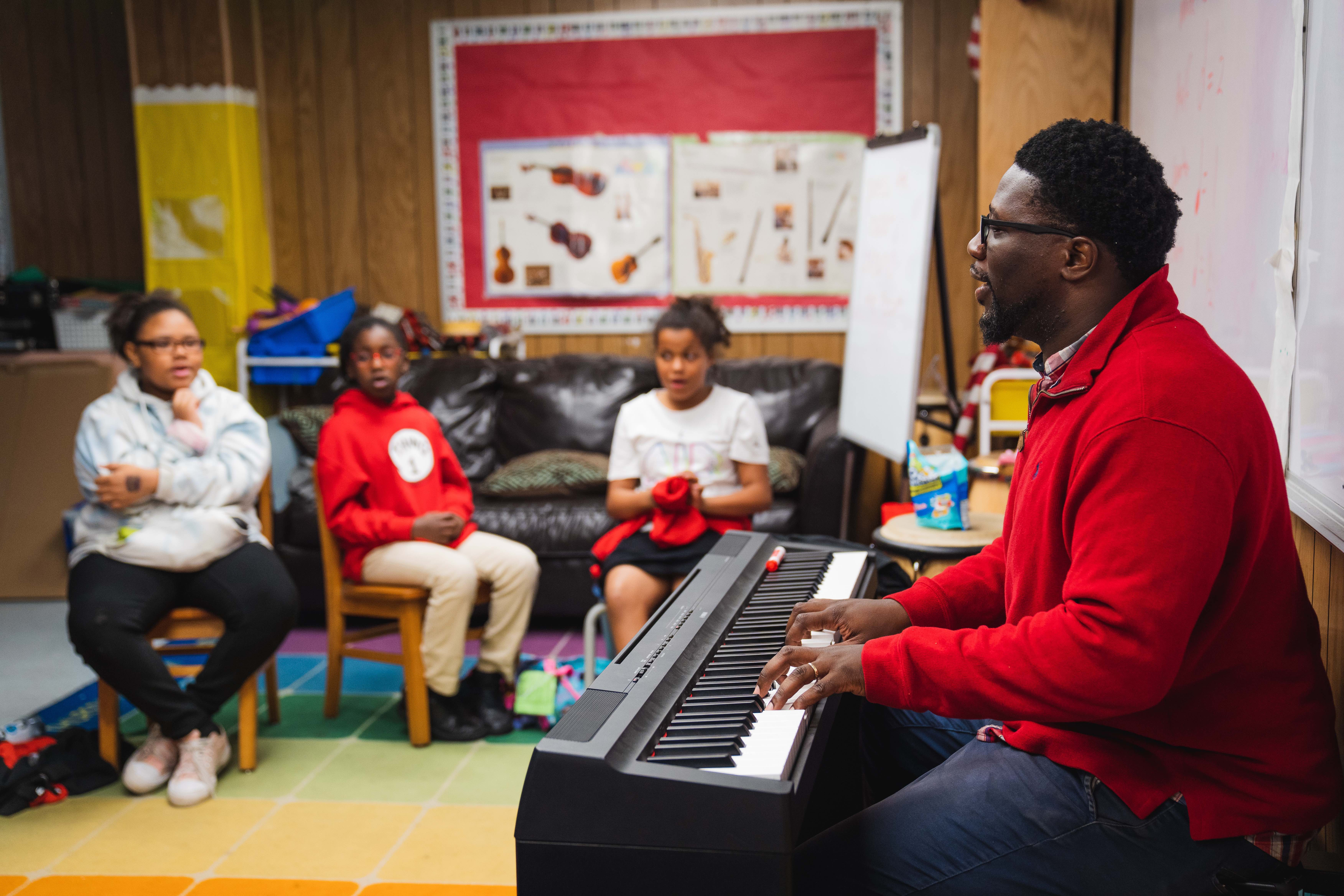 Timucuan Elementary Music Teacher teaches students on his keyboard