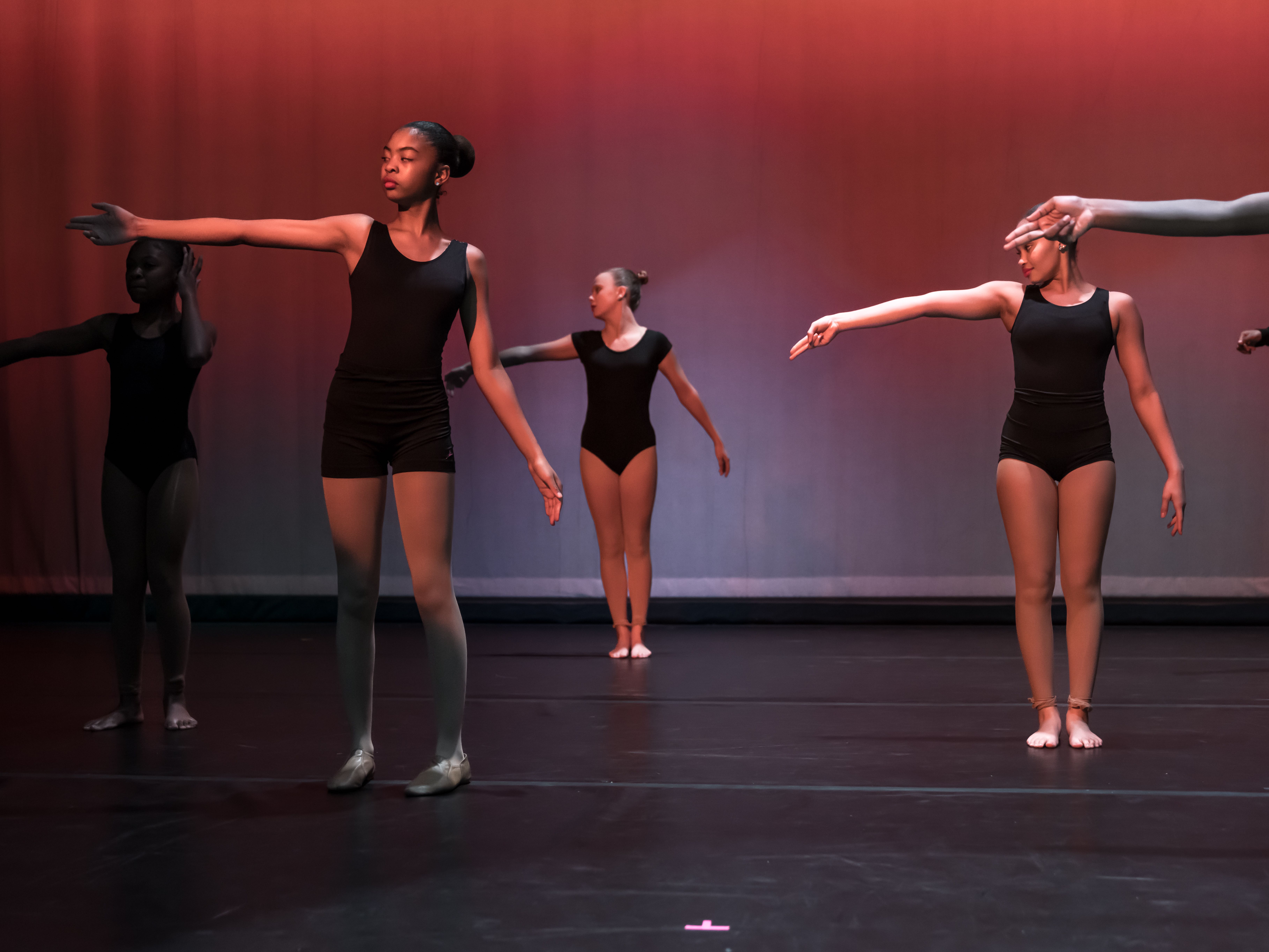 Fort Caroline dance students practice on stage