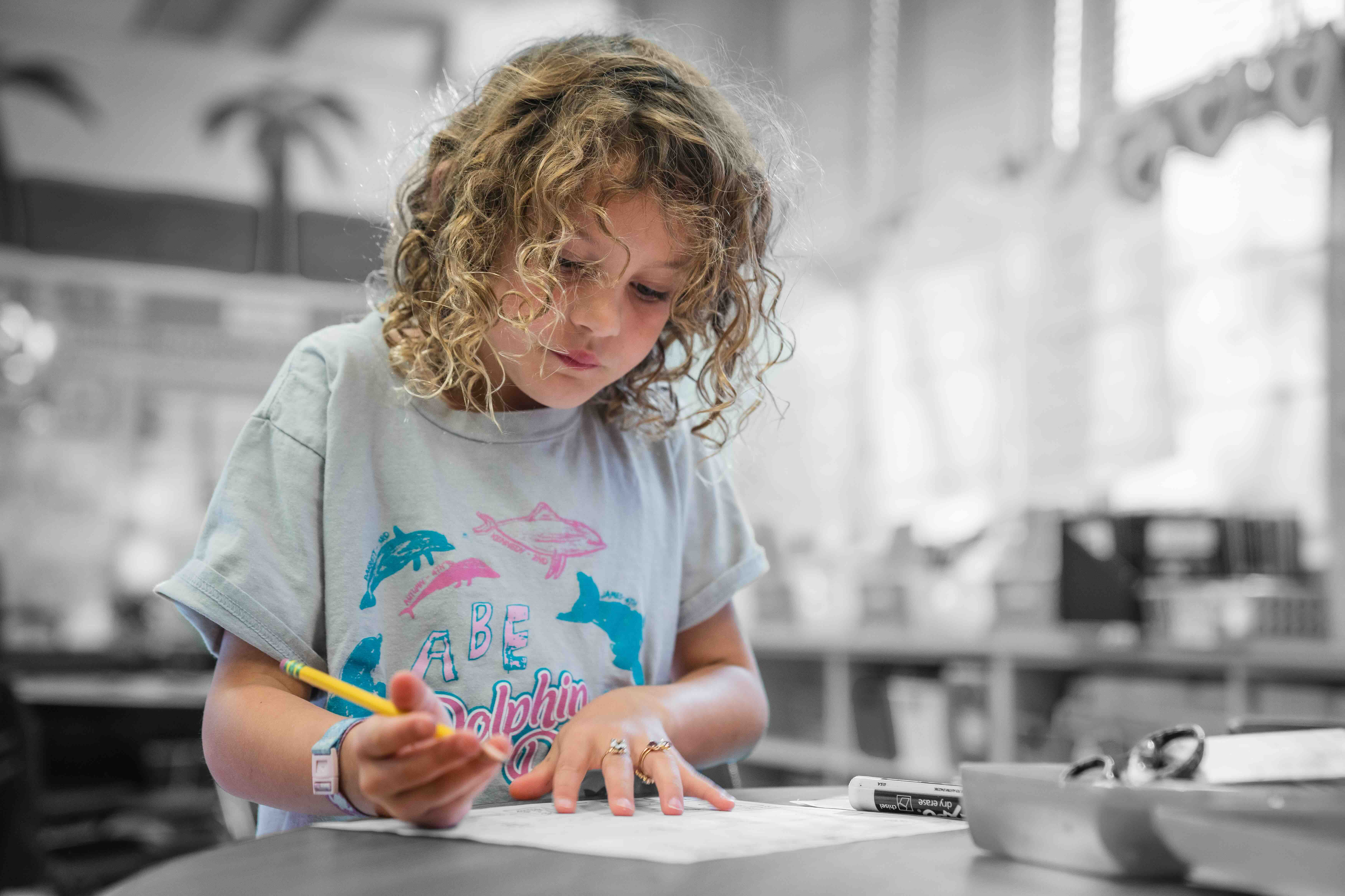 Girl writing on paper