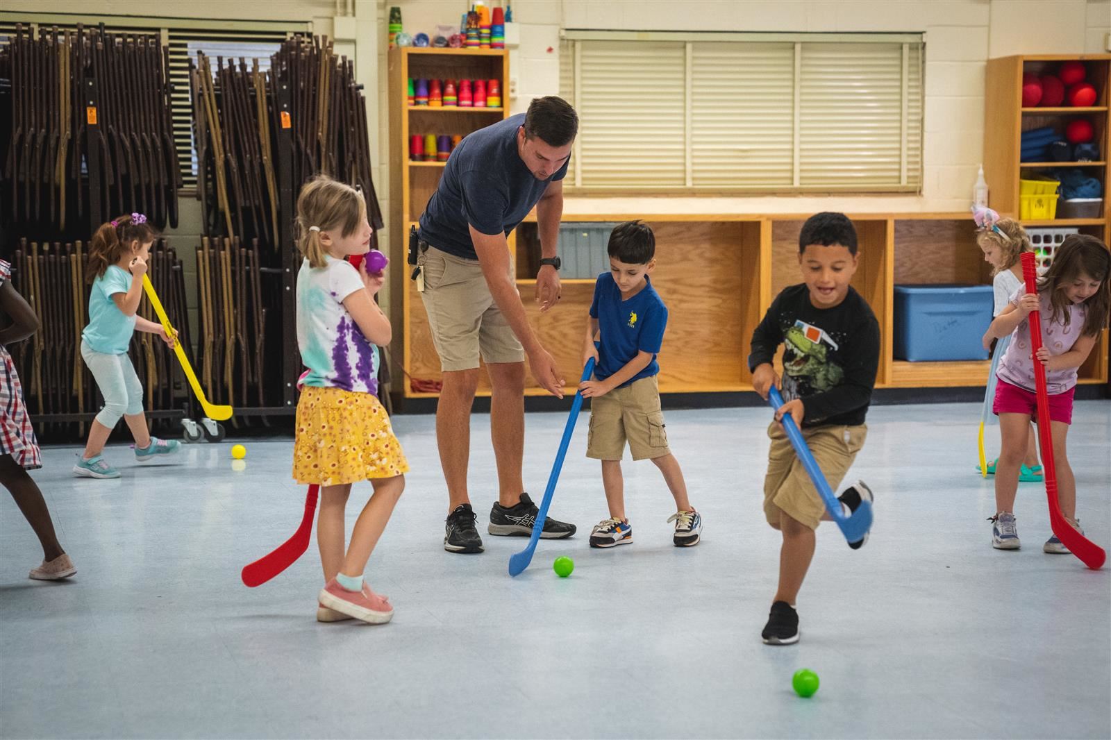 Students playing with teacher