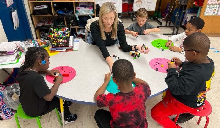 Teacher working with students