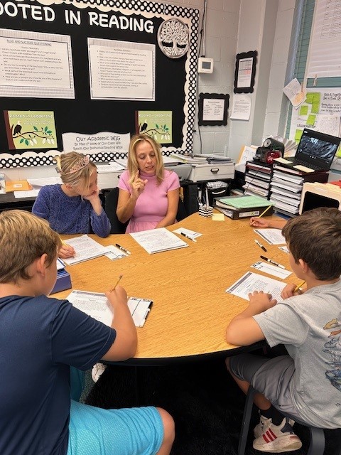 Hendricks Avenue Elementary Teacher Joy Kettel works with a group of fourth grade students