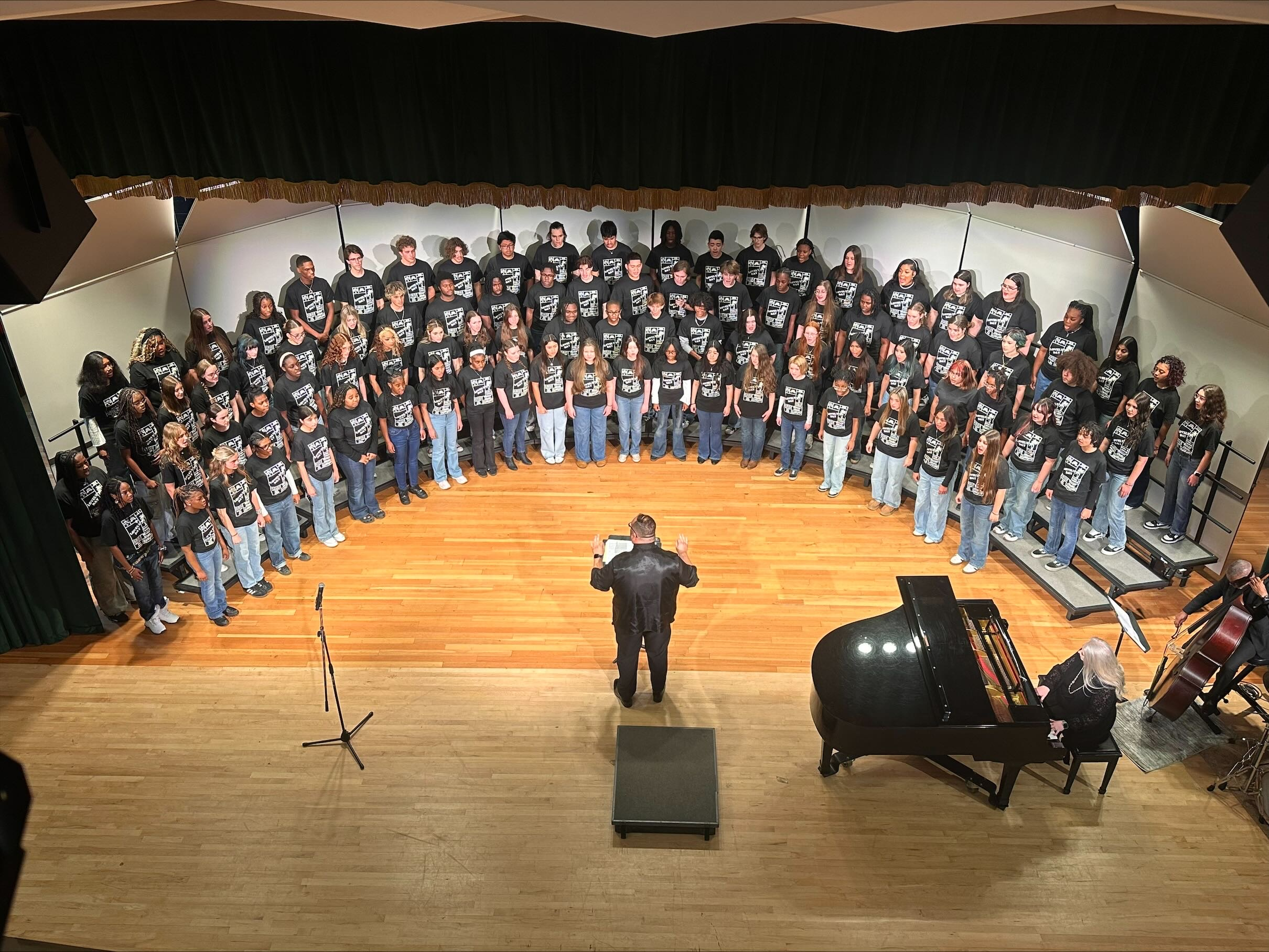 High School Honor Choir Students preparing to sing on stage