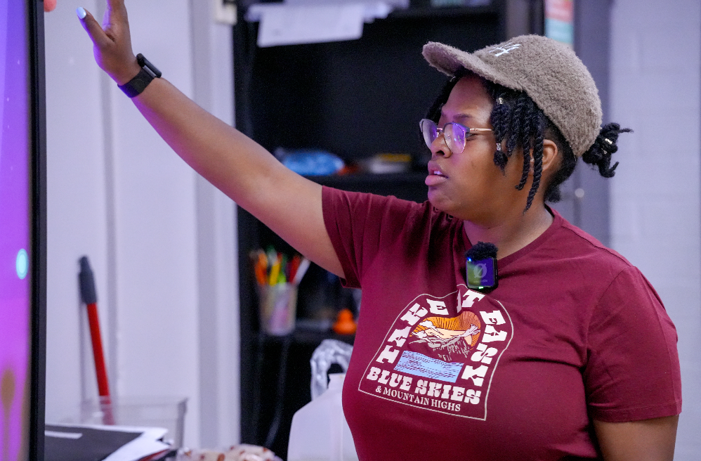 Kennerly Cotton, a sixth-grade math teacher at Westside Middle School, works with students in her classroom.