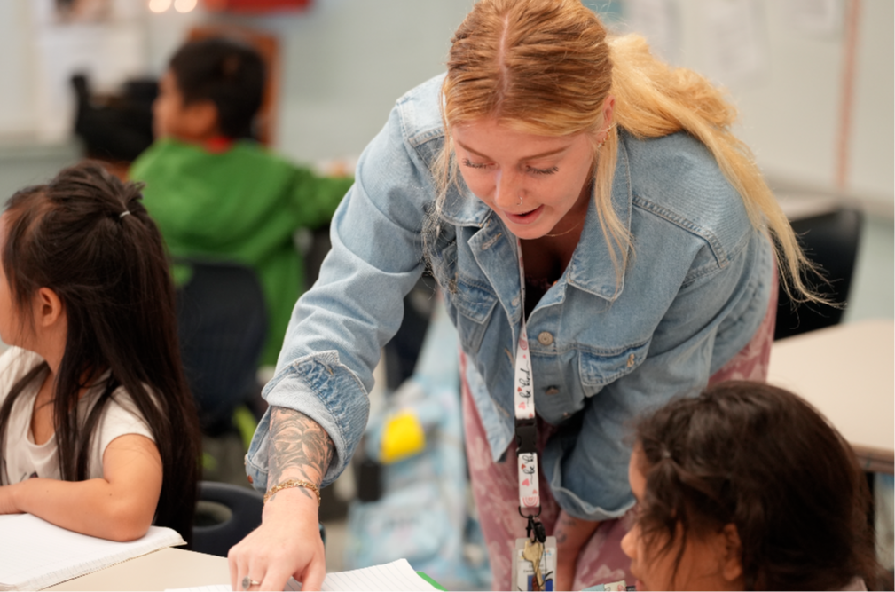 Kimberly Cromer, a second-grade teacher at Englewood Elementary School, works with students in her classroom.