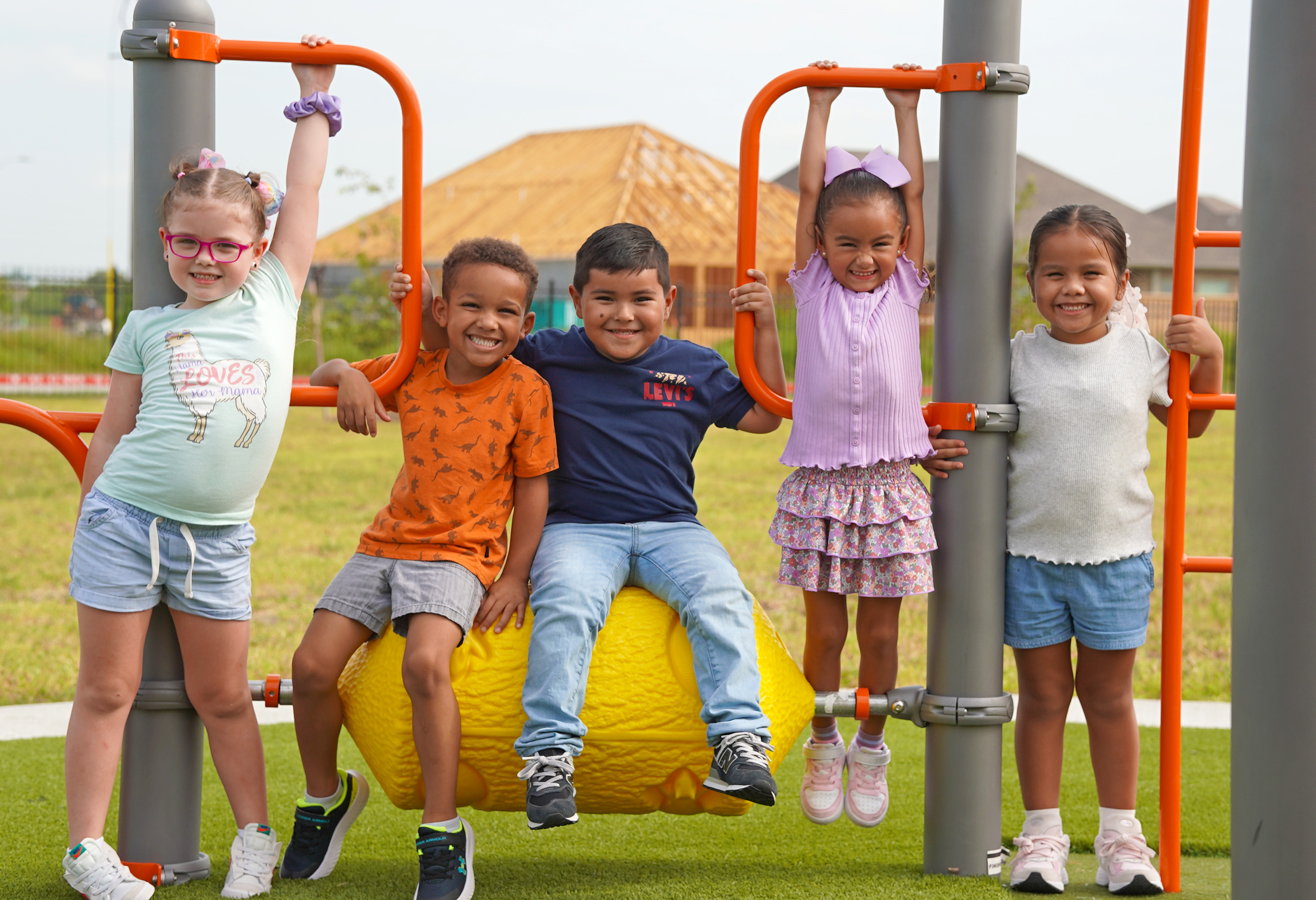 Bennett Kinder students smiling on the playground