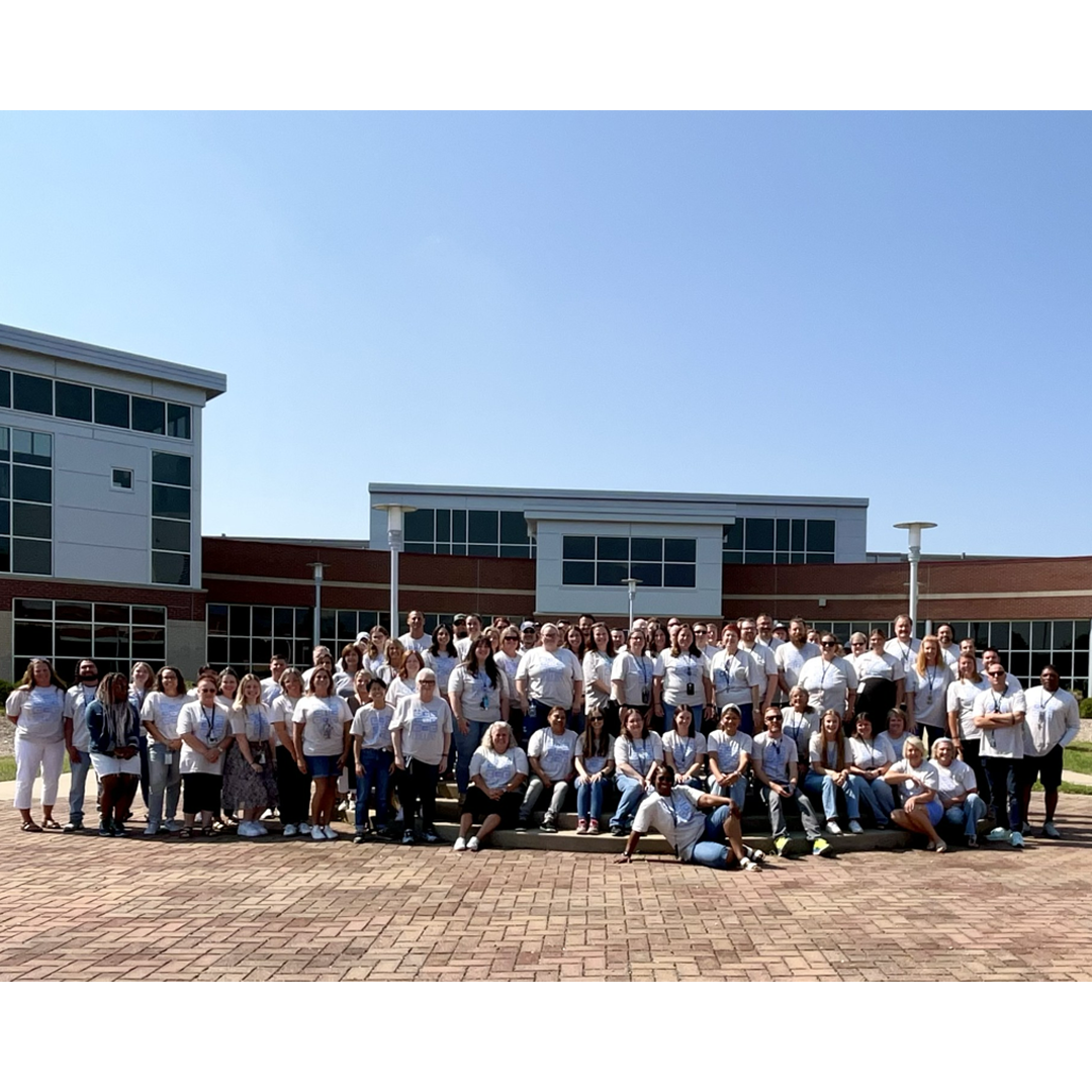 A group photo of the Collins high school staff