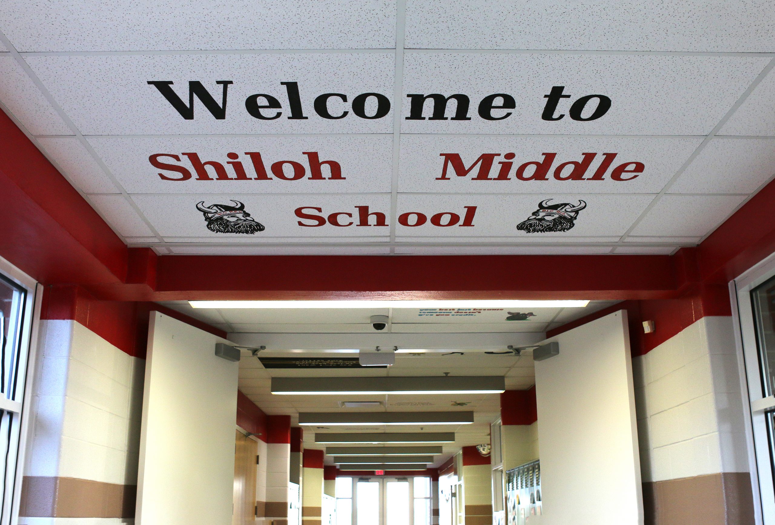 Welcome to Shiloh Middle School: a hallway adorned with a sign bearing the school's name.