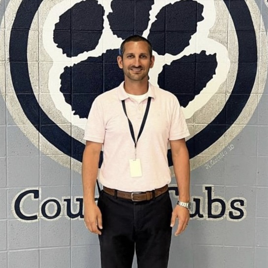 Man in a white polo shirt 