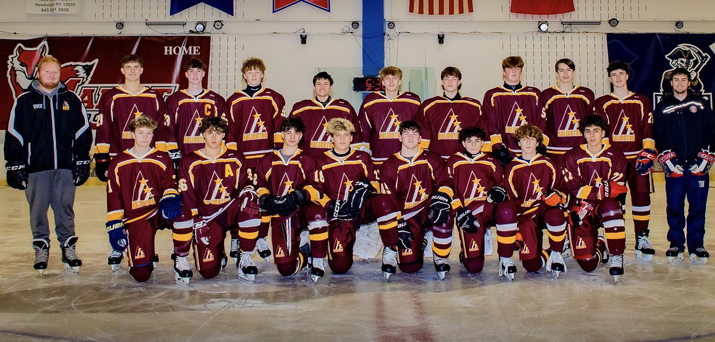 Arlington High School Varsity Hockey team group photo with coaches
