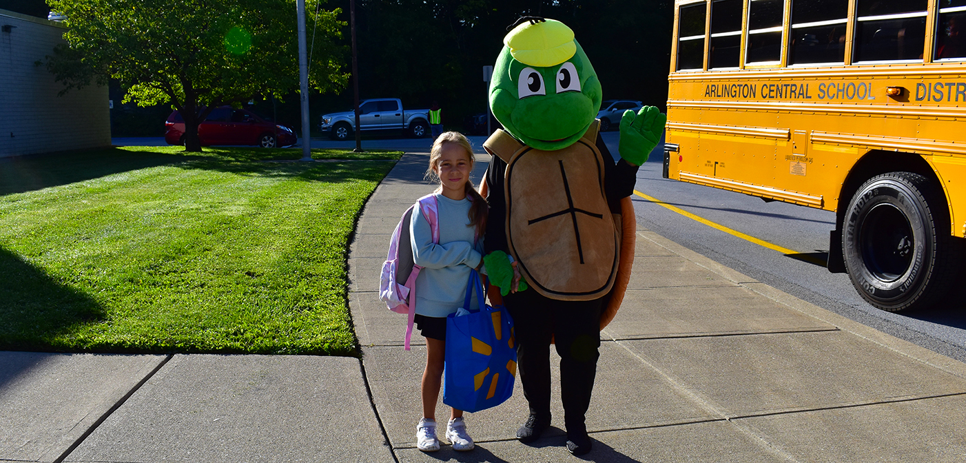 Girl with the Noxon turtle mascot