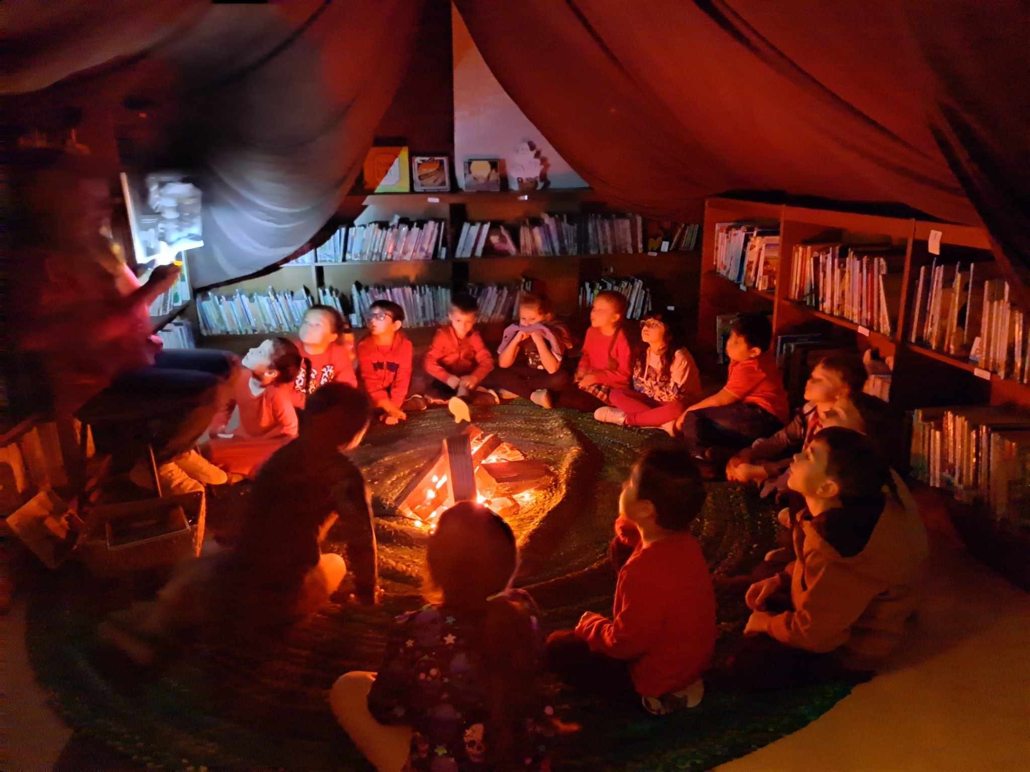 ILA Librarian reading books to students