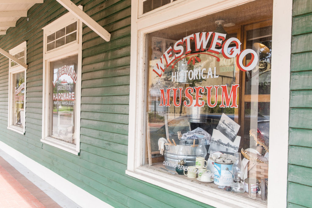 A store front with a sign that says westwego historical museum