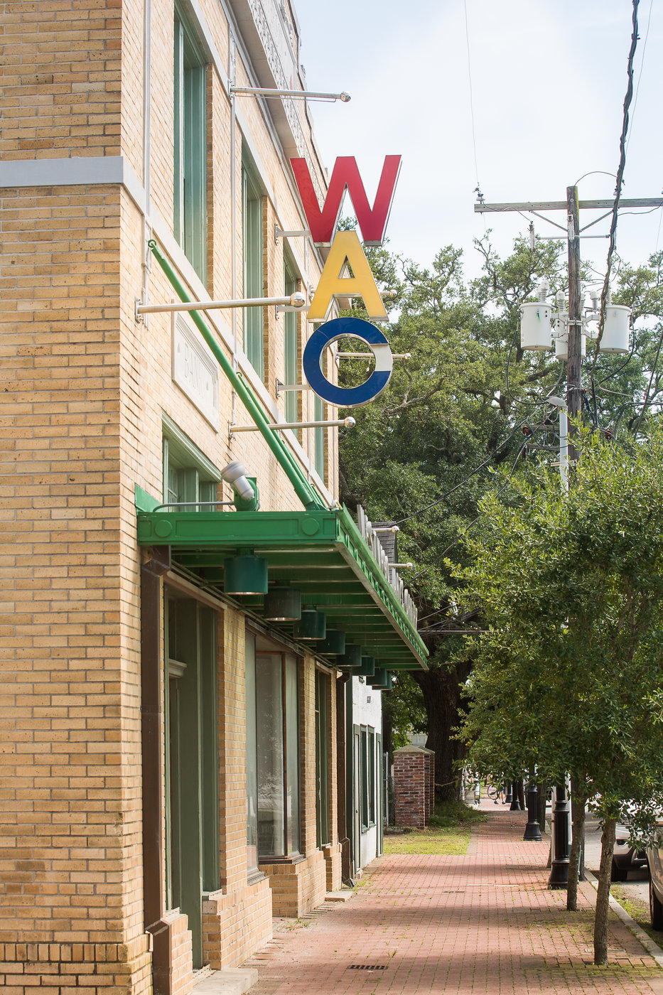 A brick building with a sign that says wac on it