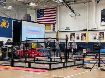  A group of people standing in a gym