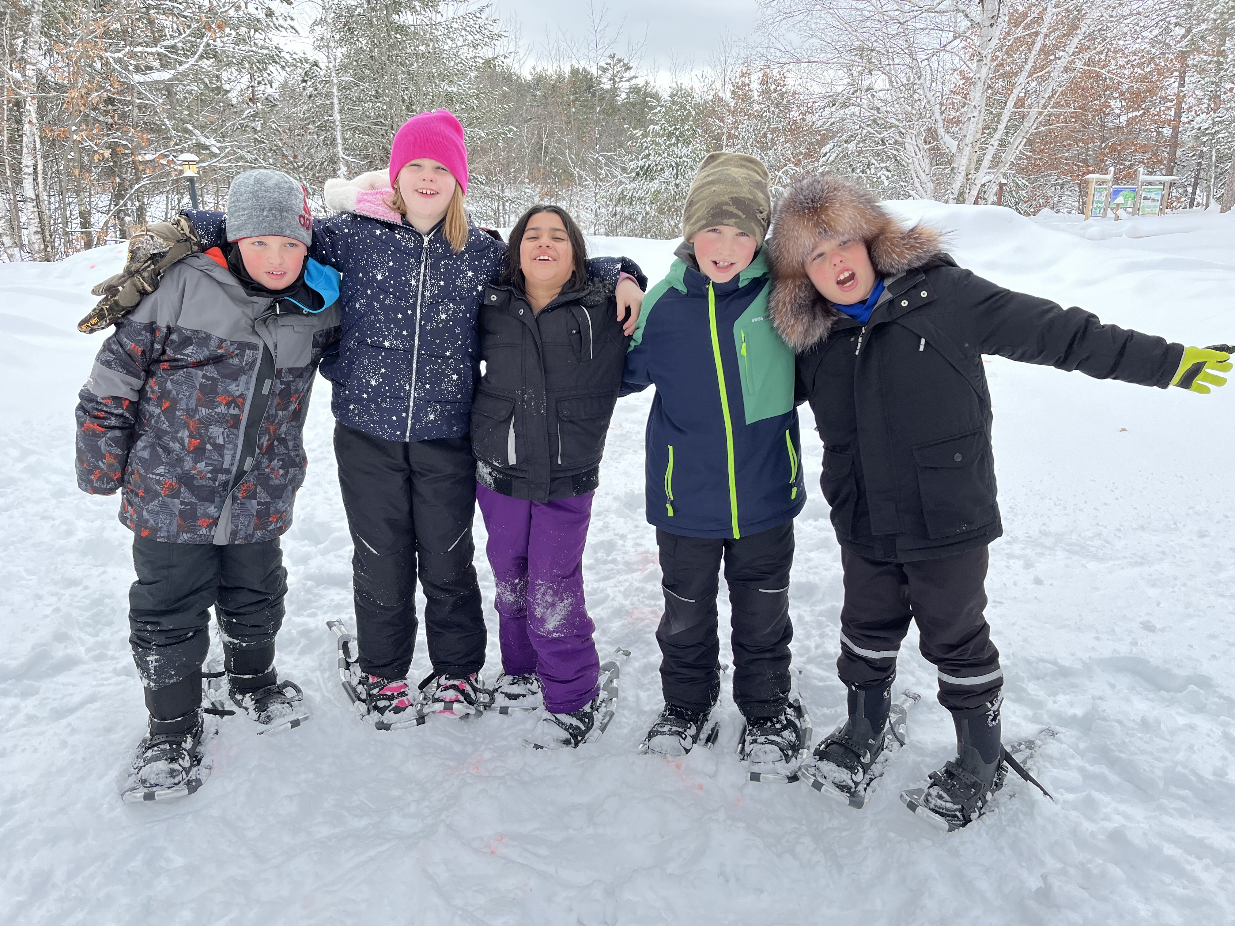 4th graders taking picture on a snow