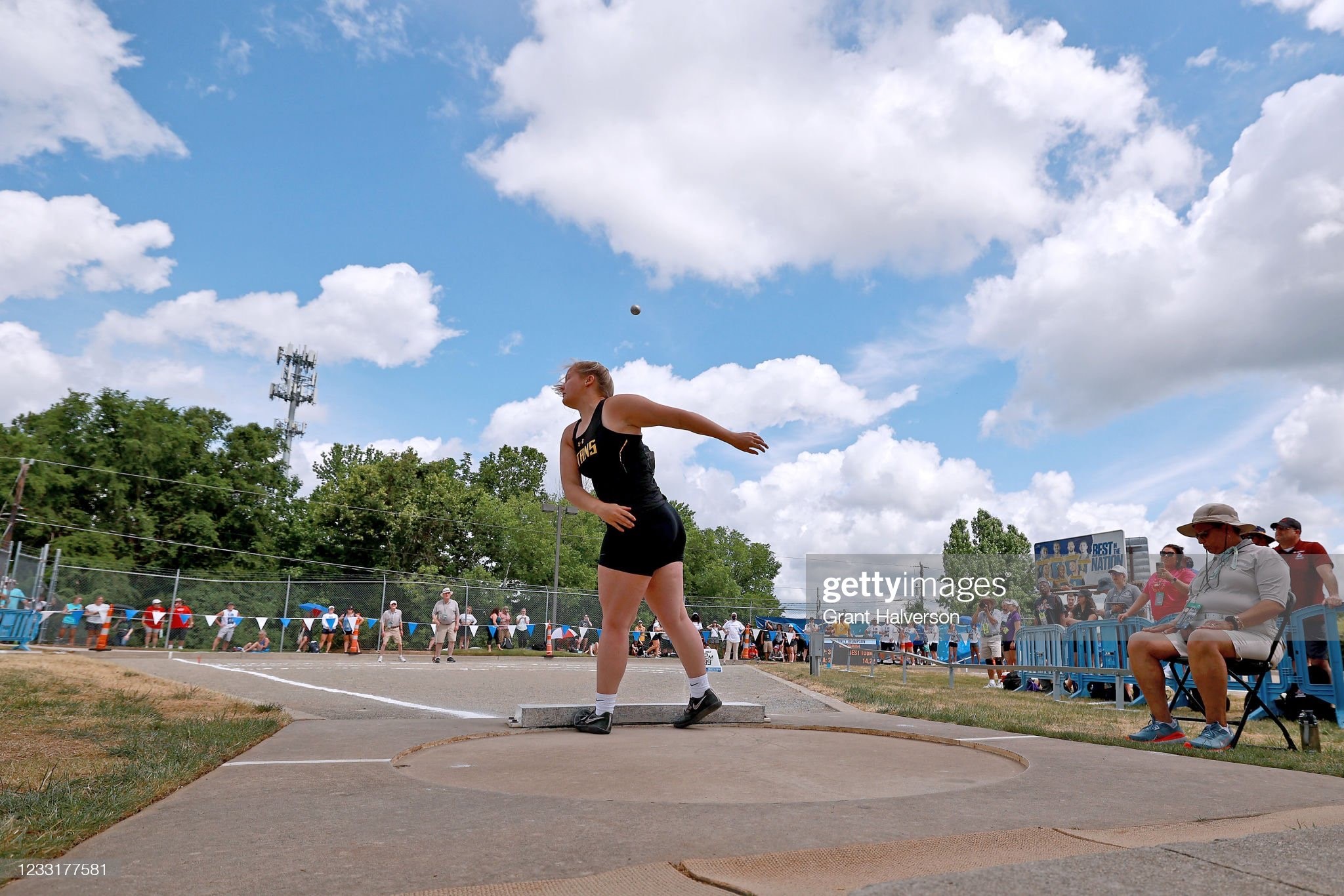 A female athlete competing in the women's discus final at the 2016 Olympic Games, throwing the discus with great strength and precision.