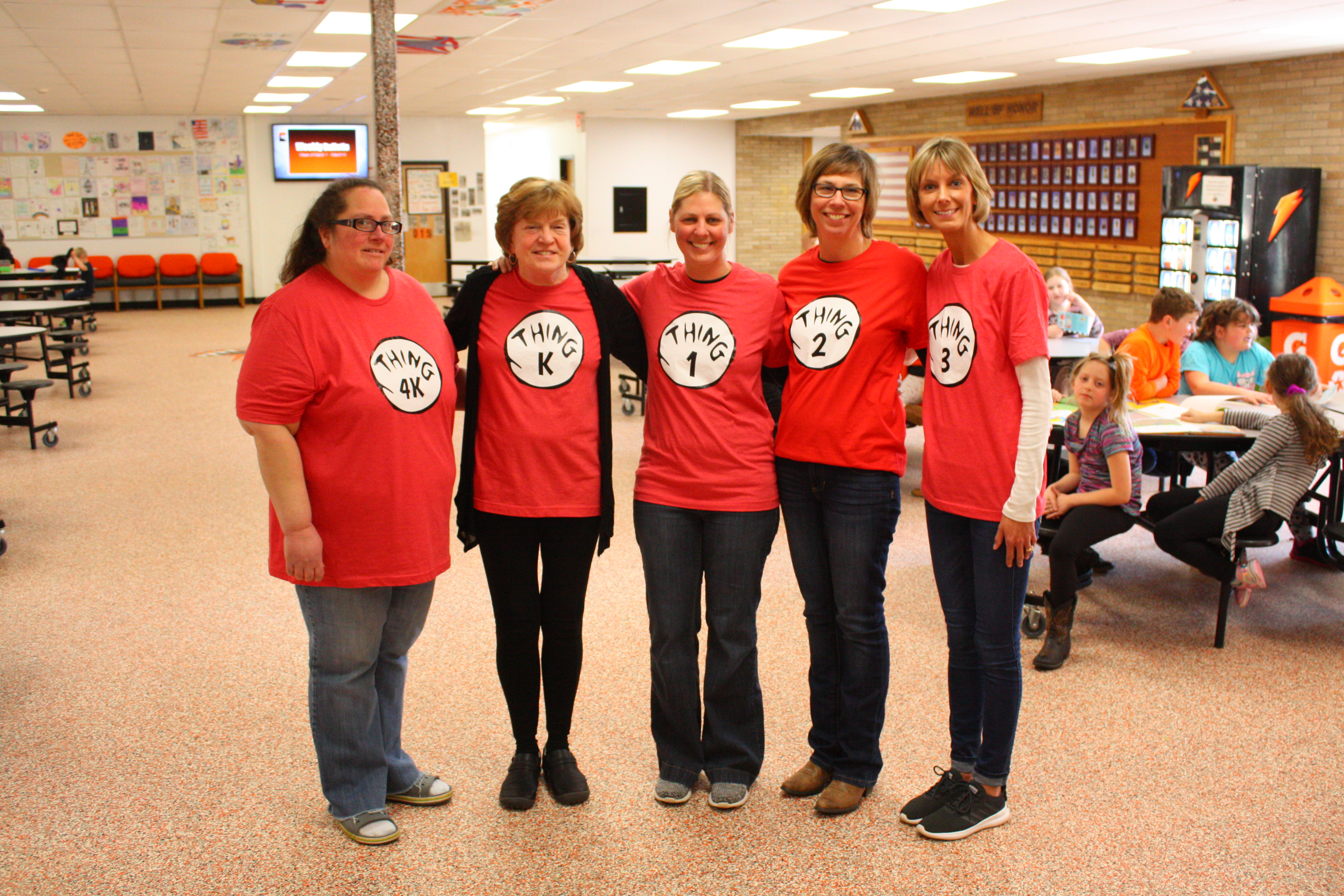 Women wearing red shirts.