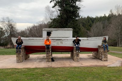 A group of people sitting on top of a boat