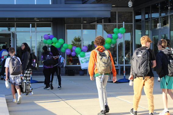students entering school building