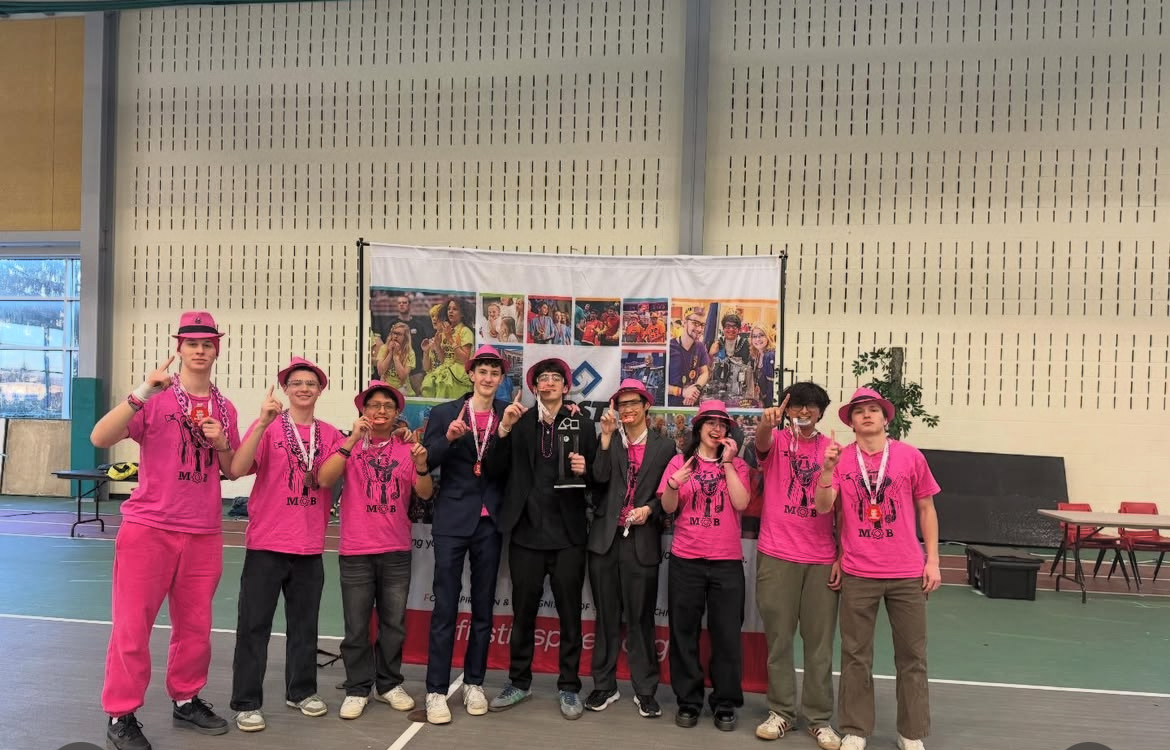 students celebrating their robotics win at NY States in Utica