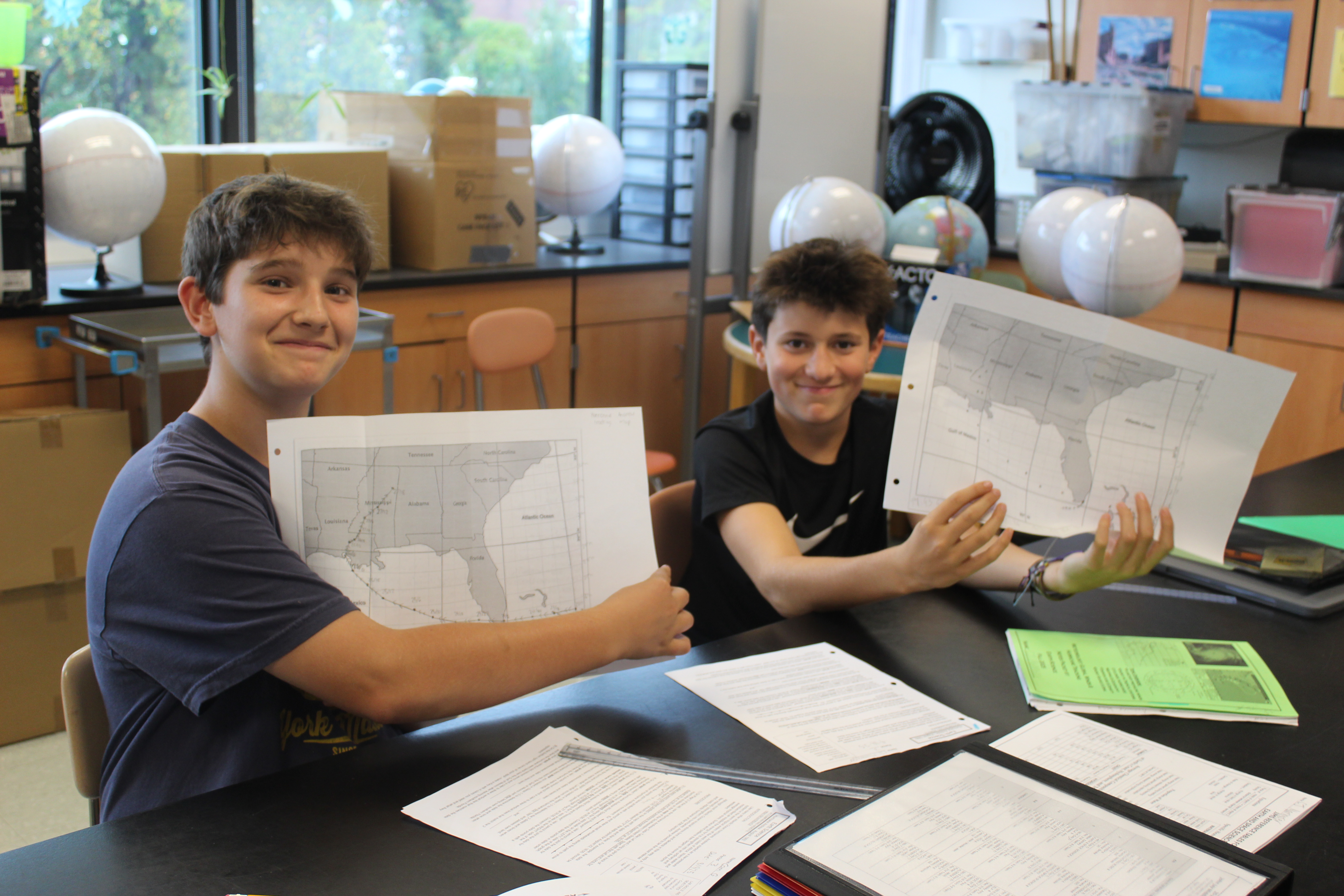 Students on Team Charisma track Hurricane Andrew during a lab.