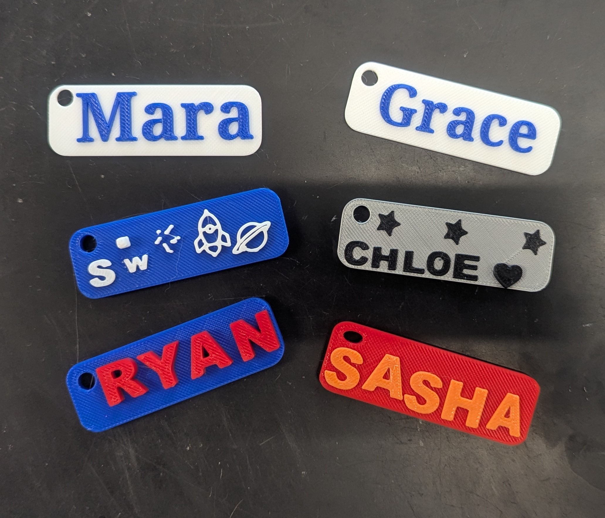 Students in Tech are designing and fabricating key chains using the 3D printer.