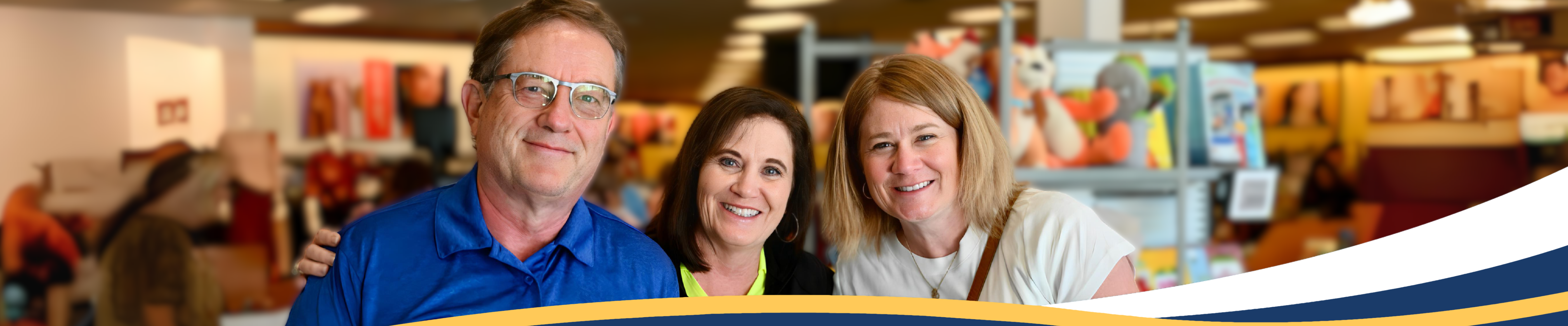 Three people standing in a store