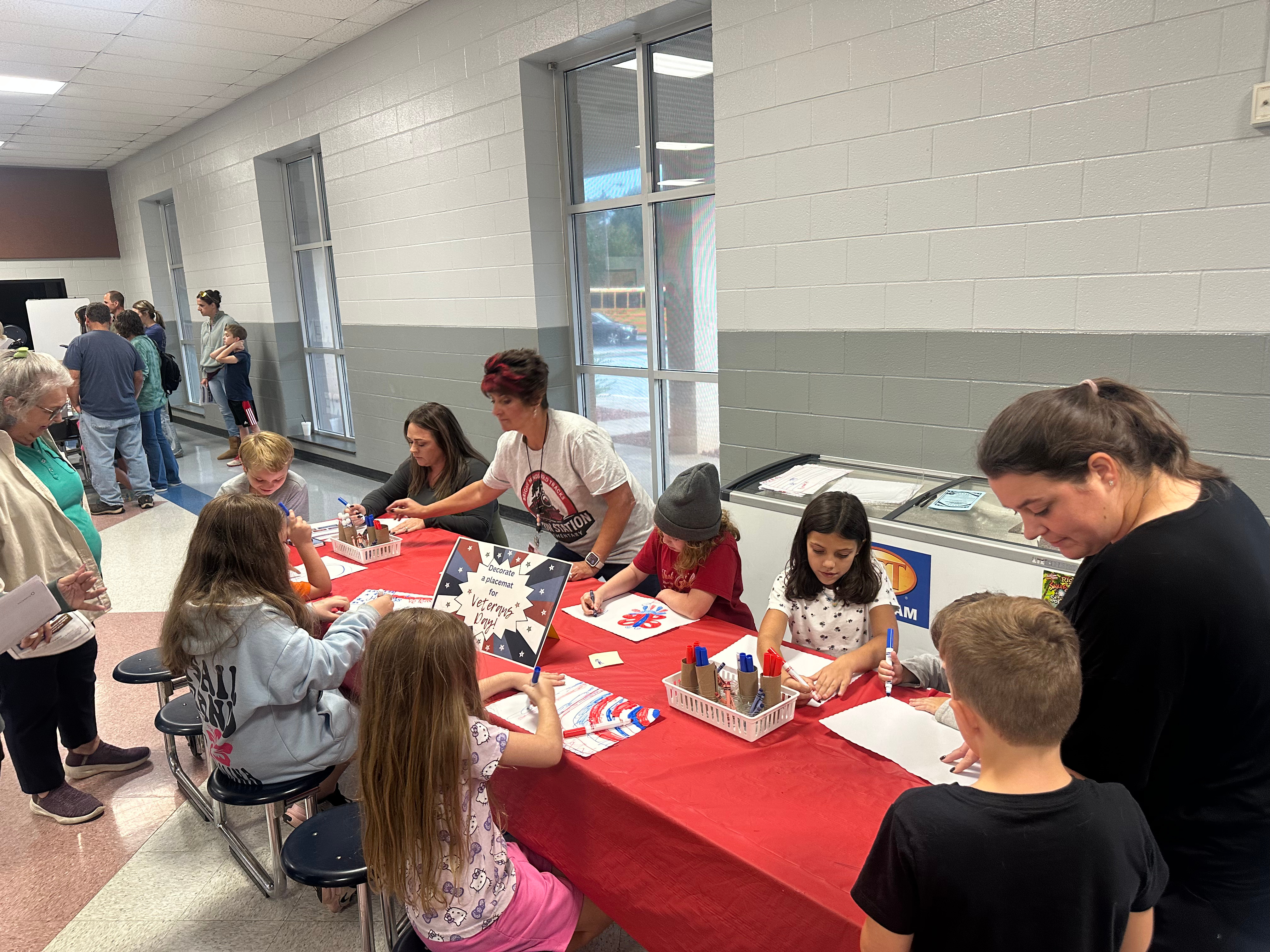 Students complete Leader in Me activities at family night.