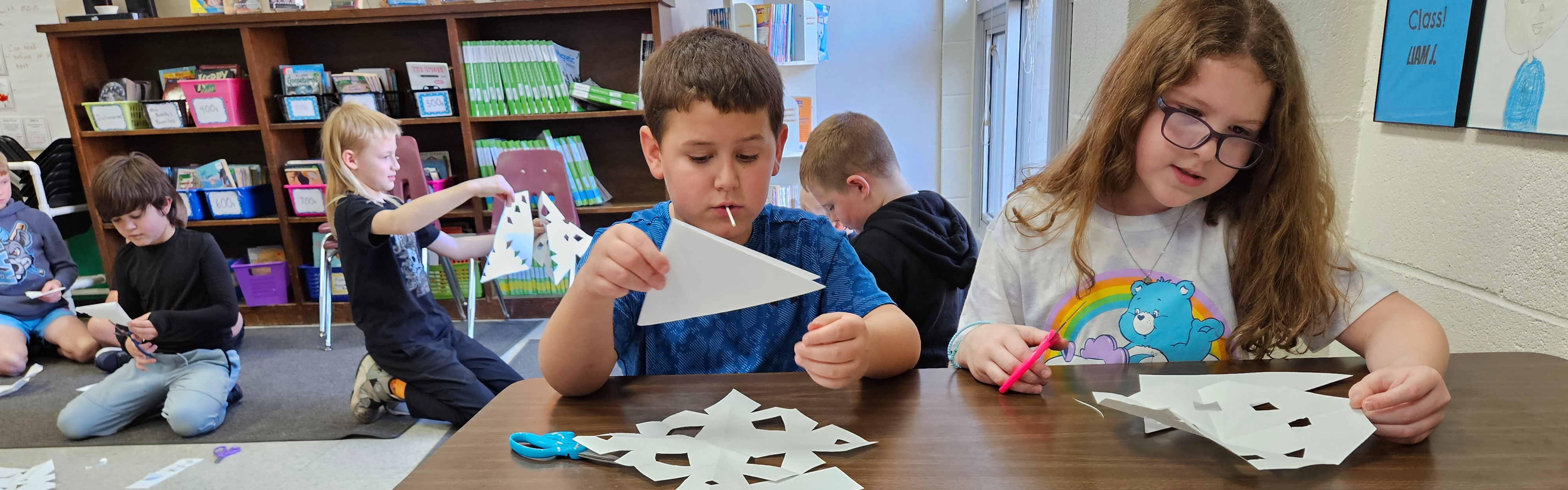 Third grade students use visual reasoning in a snowflake challenge.