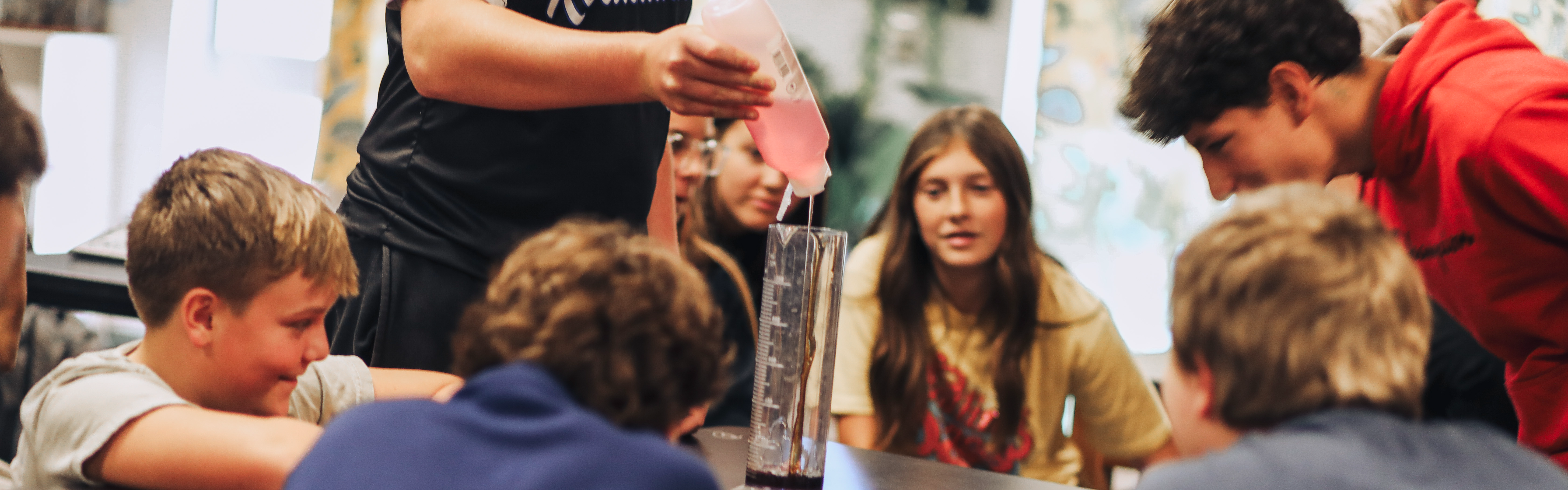 Students Watching 8th Grade Science Experiment